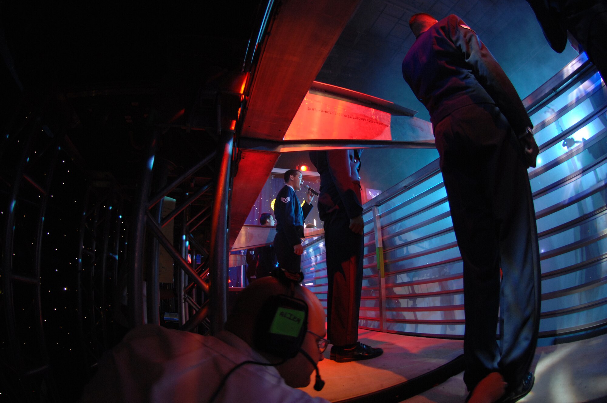 Once the lift in the middle of the stage was lowered, the male vocalists stepped on and were raised into position while singing during the final set of music for the 2007 Tops In Blue show at RAF Mildenhall, July 25. (U.S. Air Force photo by Tracy L. DeMarco)