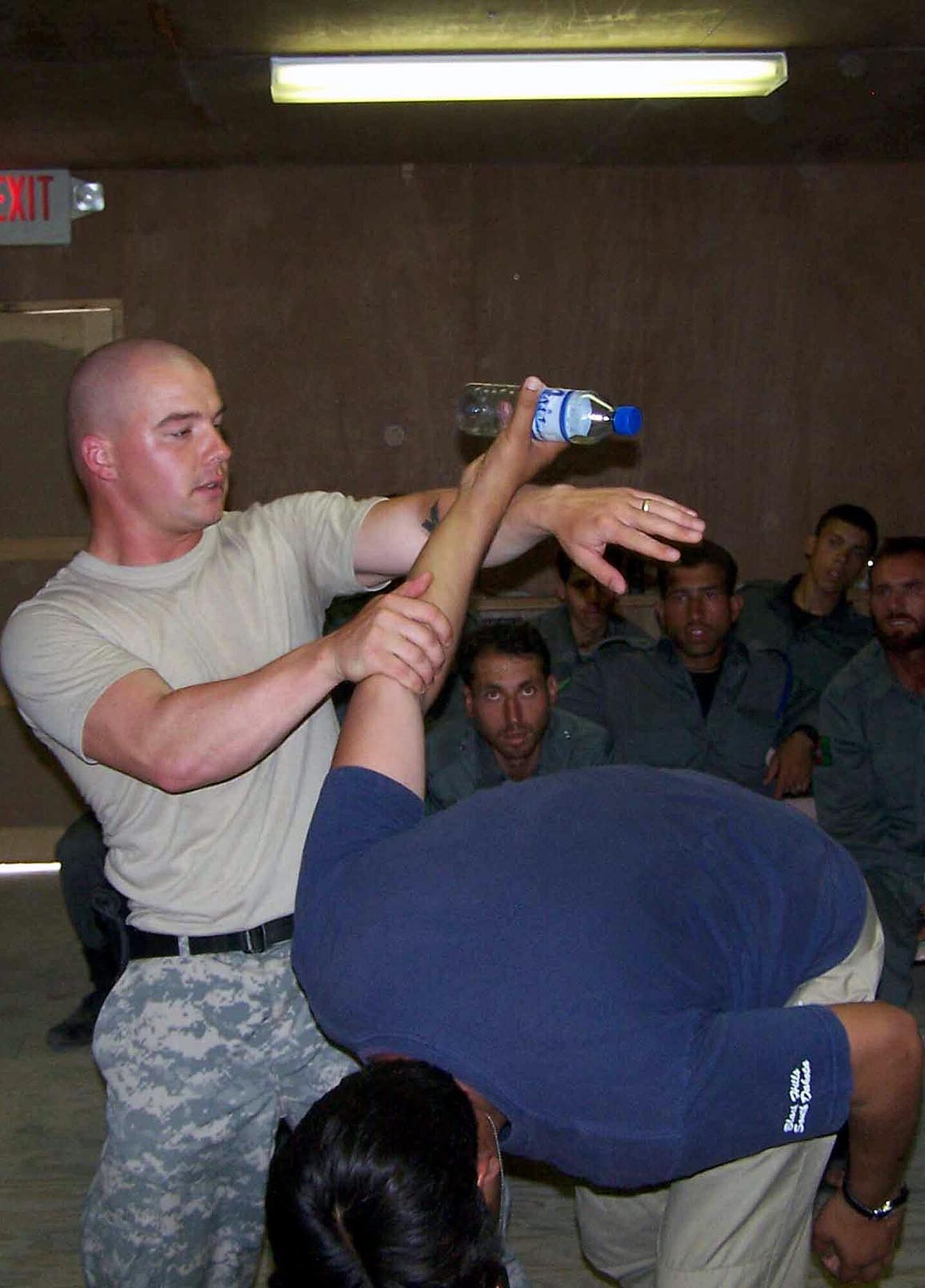 Air Force Staff Sgt. Daniel Smith, Provincial Reconstruction Team Police Tactics and Refresher Training NCOIC, teaches a class of Afghanistan National Police students at  Forward Operating Base Mehtar Lam, Afghanistan.  Sgt. Smith has trained more than 200 ANP and Afghanistan National Auxiliary Police since arriving in Afghanistan April 1.  (courtesy photo) 
