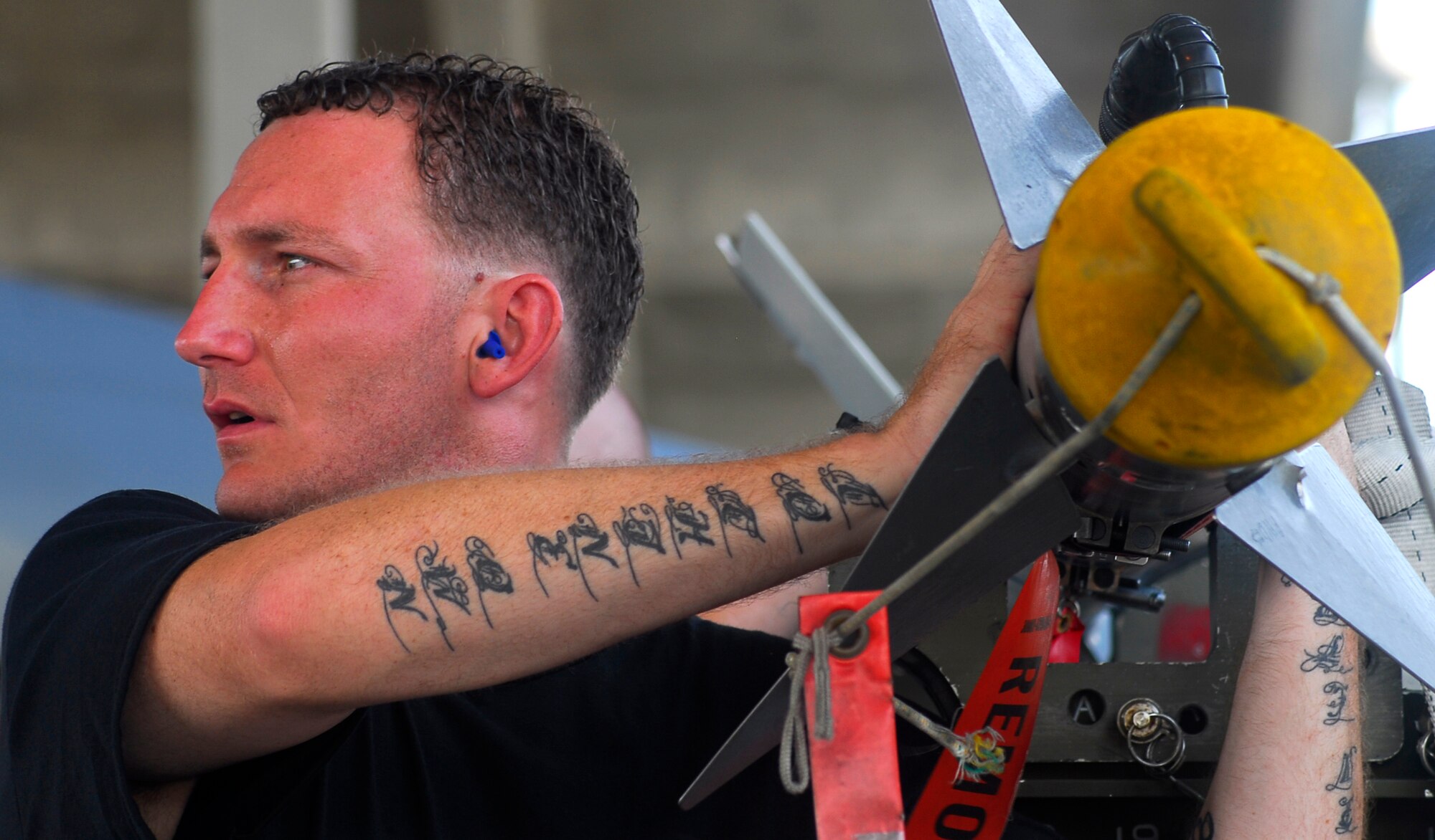 Staff Sgt. William Filyaw ensures the area is cleared prior to unloading an AIM-9 from the munitions trailer during the Weapons Load Crew of the Quarter competion held here July 20. Sergeant Filyaw is assigned to the 44th Aircraft Maintenance Unit, 18th Aircraft Maintenance Squadron. The 44th AMU won the competition. (U.S. Air Force photo/Airman 1st Class Sheila deVera) 

