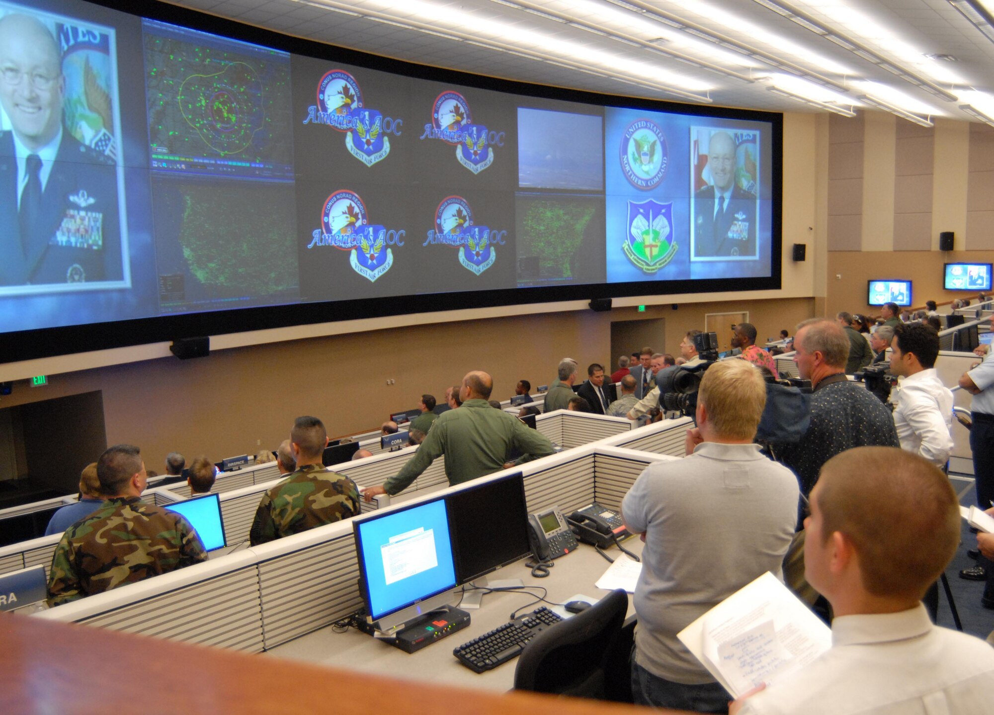 Guests look on as video presentation is displayed on new $3.5 million data wall at dedication of new AFNORTH air and space operations center.