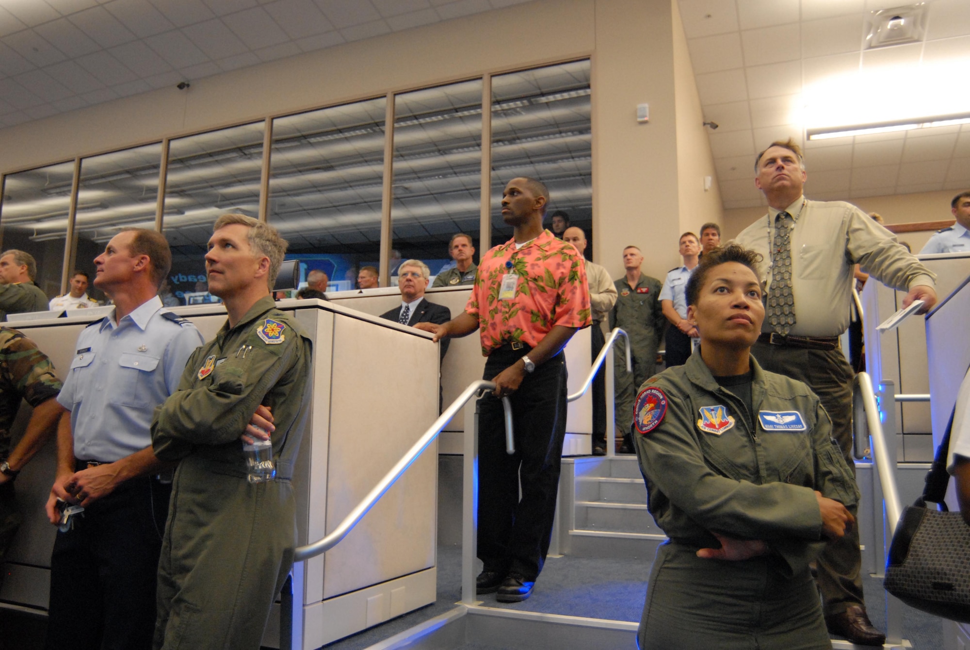 Guests look on as video presentation is displayed on new $3.5 million data wall at dedication of new AFNORTH air and space operations center.