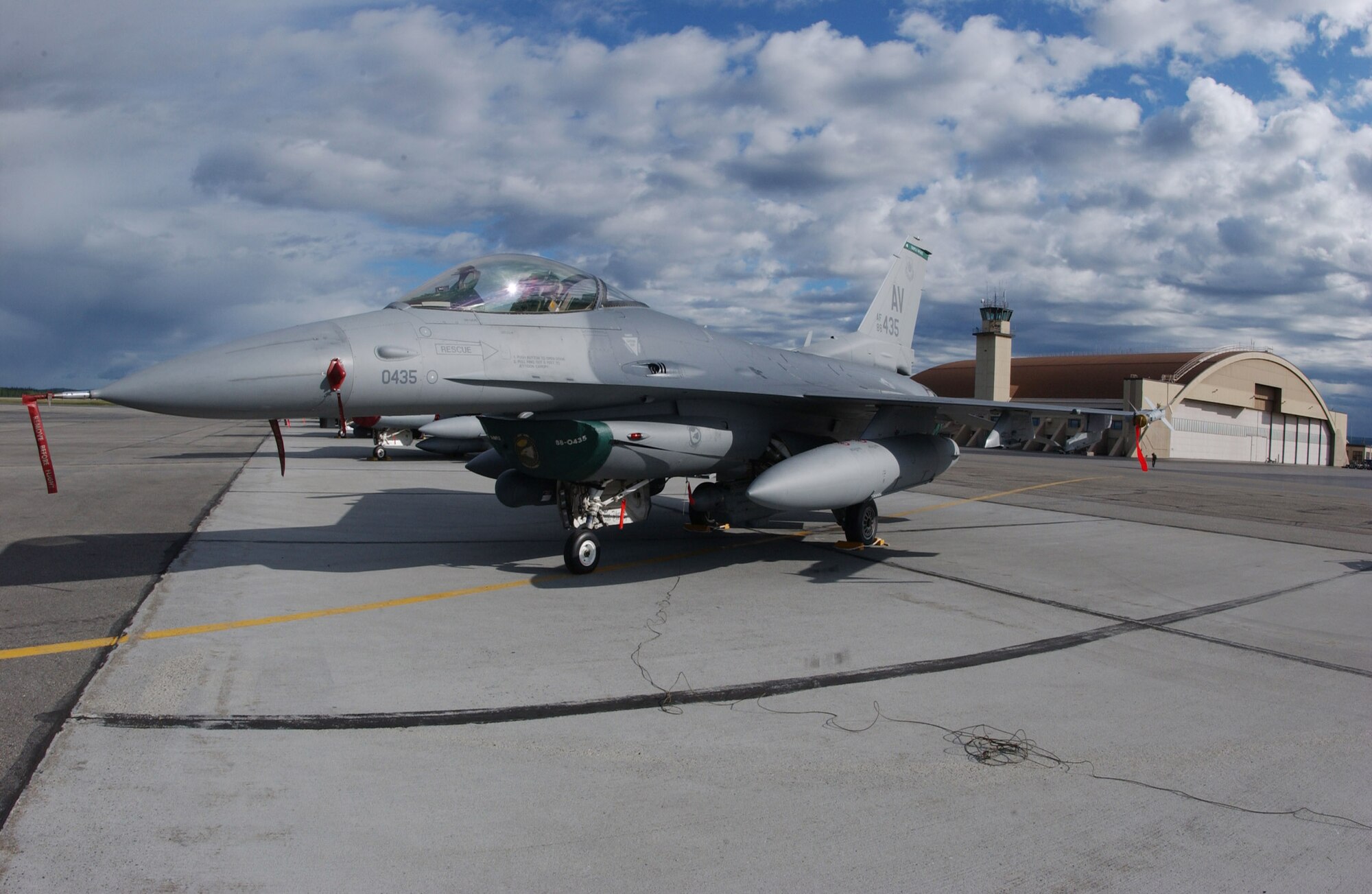 An F-16 Fighting Falcon from Aviano Air Base, Italy, sits on the tarmac at Eielson Air Force Base, Alaska, May 31 for Red Flag-Alaska 07-2. The Pacific Air Forces-directed field training exercise allows U.S. and coalition forces to fly under simulated air combat conditions. It is conducted on the Pacific Alaska Range Complex with air operations flown out of Eielson and Elmendorf AFB. The aircraft is from the 555th Fighter Squadron. (U.S. Air Force photo/Airman 1st Class Jonathan Snyder)
