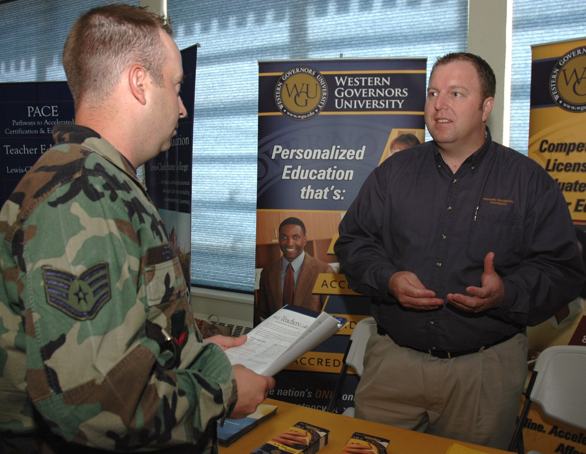 MOUNTAIN HOME AIR FORCE BASE, Idaho -- Staff Sgt. Justin Hertz, 366th Mission Support Squadron, discusses off-duty education programs with Mike Manning from Western Governors University in Salt Lake City during the base’s annual education fair June 1 at the Community Activities Center here. Sergeant Hertz was one of dozens of military members and spouses who visited the fair to discuss education opportunities with representatives from various colleges and universities catering to those in the armed forces. Representatives from the Department of Education’s Troops to Teachers program were also on hand to help people learn how to transfer from active duty service into the civilian education sector. (U.S. Air Force photo/Master Sgt. Brian S. Orban)
