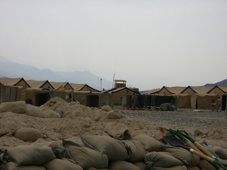 Personnel tents and a defensive observation tower are just beyond the mortar
pit of a newly constructed forward operating base miles from Bagram Air Base in
Afghanistan. The FOB was built by members of the 56th Civil Engineer Squadron
while under enemy attack and austere conditions.  Photo by Tech. Sgt. Steven Goe