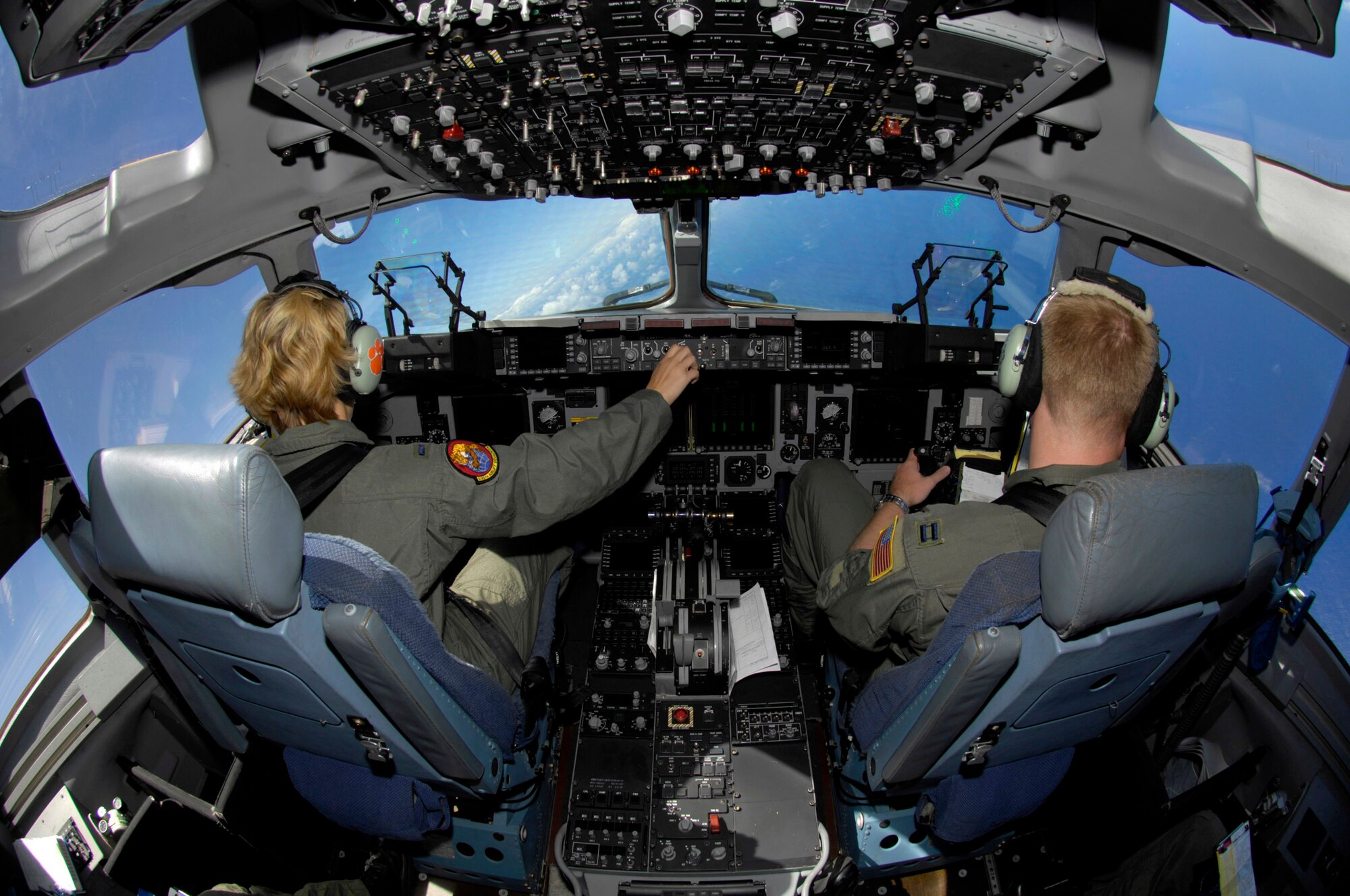 C-17 Globemaster III pilots 1st Lt. Lindsay McWhirter (left) and Capt. Jonathan Mackay practice low-level flying off the coast of Hawaii May 30. The pilots are from the 535th Airlift Squadron, Hickam Air Force Base, Hawaii. (U.S. Air Force photo/Tech. Sgt. Shane A. Cuomo)