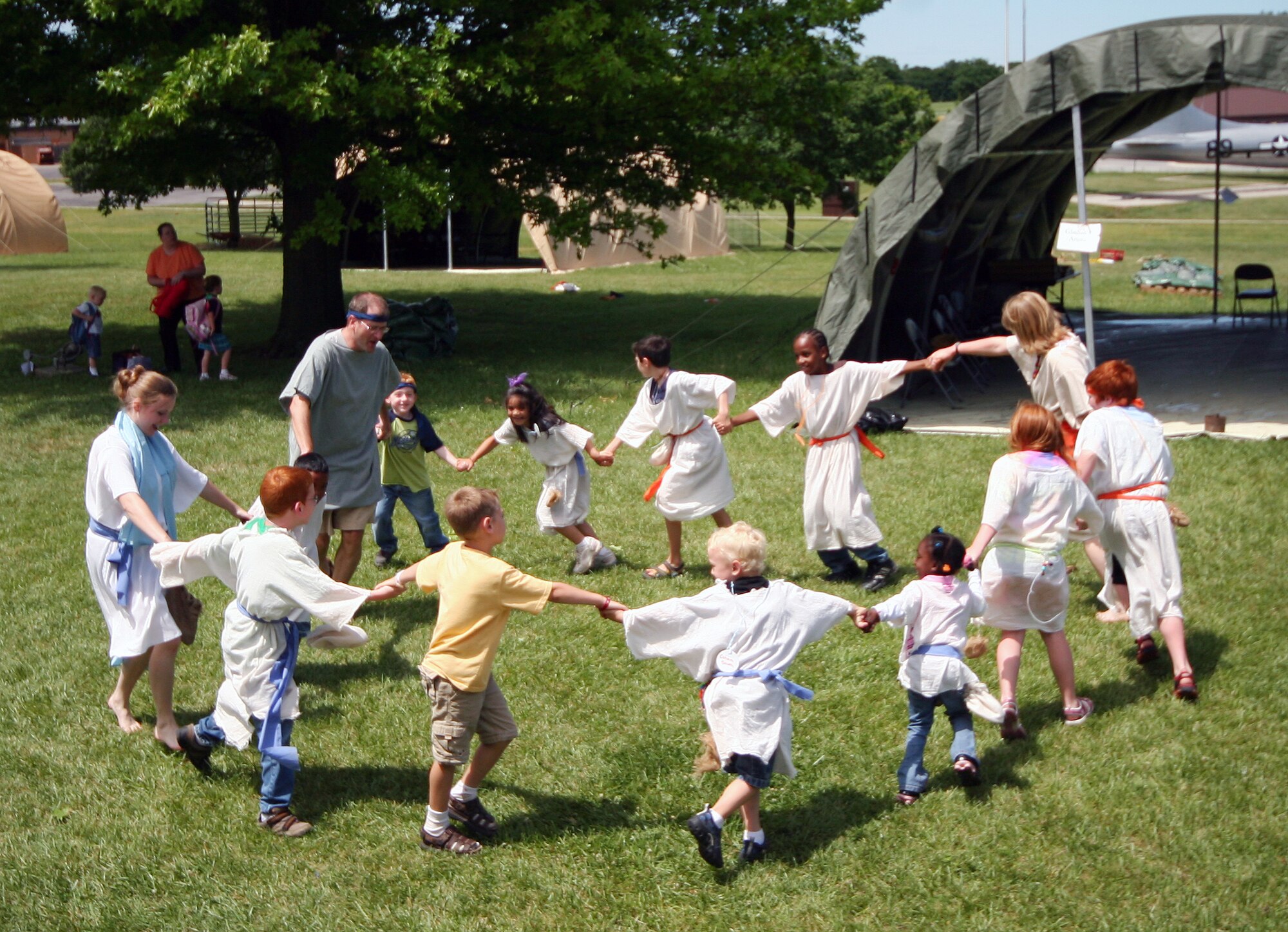 Staff and students of the Whiteman Chapel's Vacation Bible School, "Marketplace 29 A.D." perform a Hora dance June 1. The Hora is a traditional celebration dance performed at many Jewish weddings. (U.S. Air Force photo/Tech. Sgt. Matt Summers. )