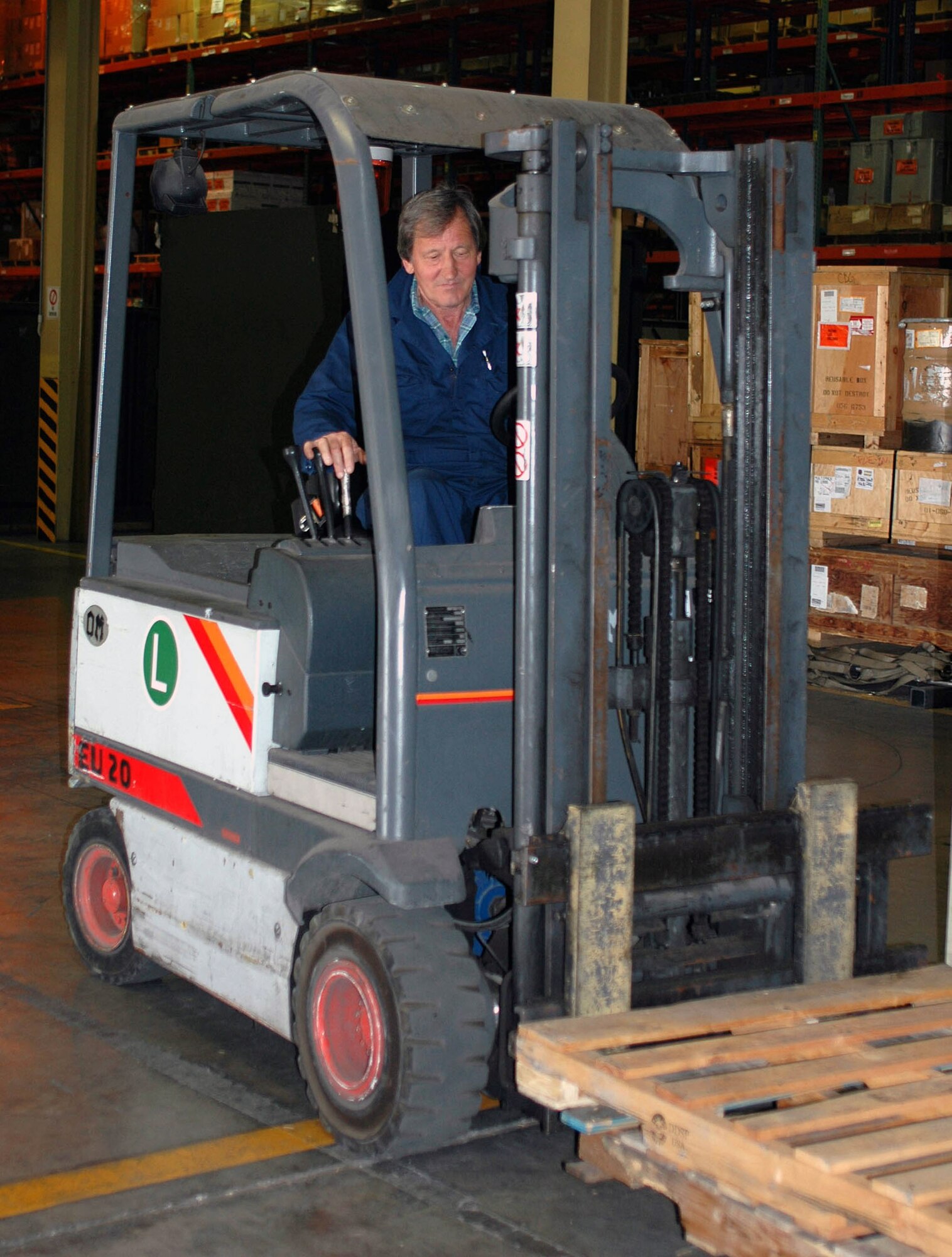 Vidotto Lorenzo stacks pallets May 31 to make more room in an Aviano Air Base, Italy, supply warehouse. Mr. Lorenzo is assigned to the 31st Logistics Readiness Squadron. (U.S. Air Force photo/Staff Sgt. Colleen Wieman) 