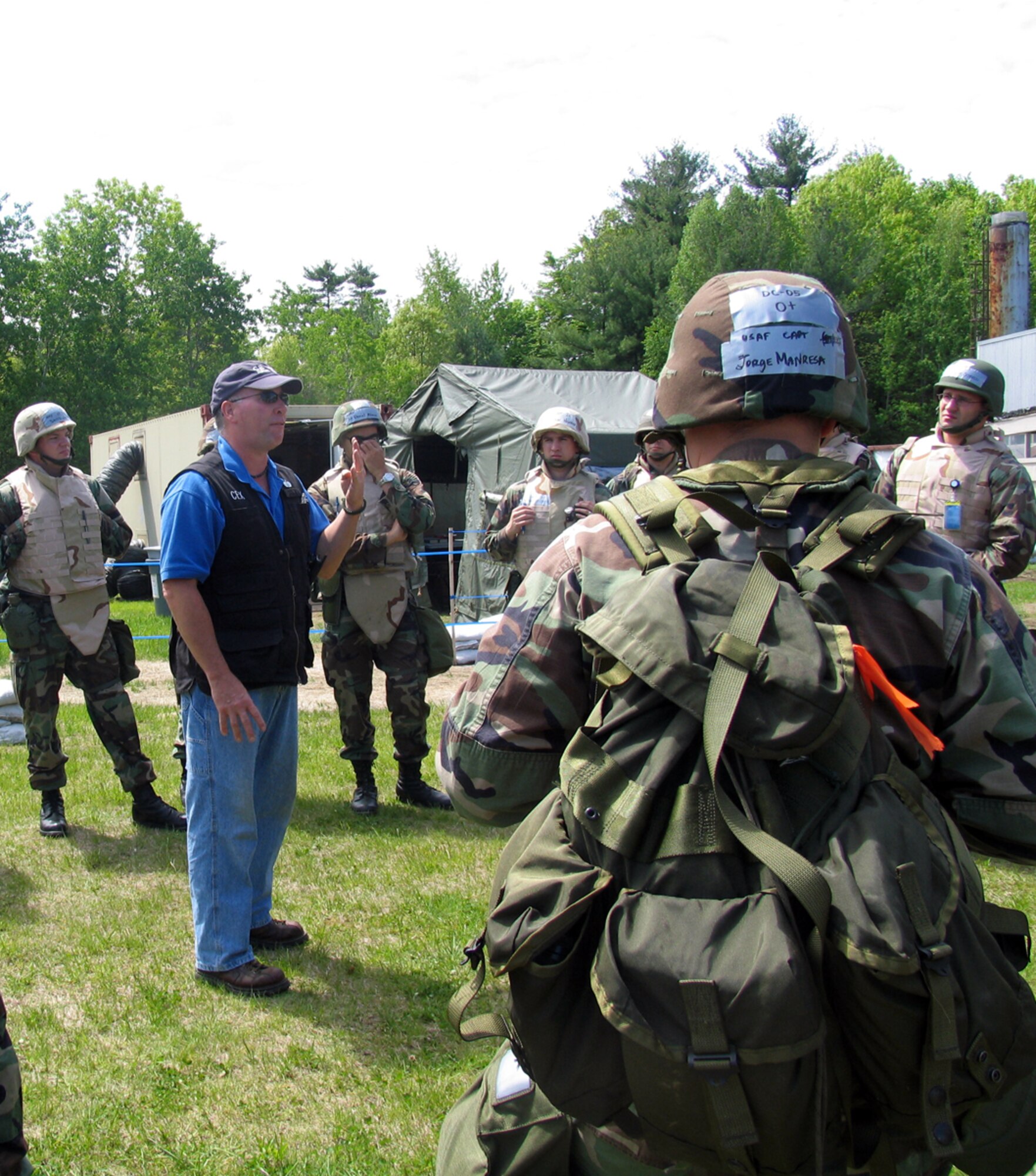 Brent Nagele, 66th Mission Support Group Civil Engineering Training and Emergency Response Office, discusses Post Attack Reconnaissance sweep techniques with Hanscom personnel assigned to PAR teams during the May Base Readiness Exercise.  (US Air Force photo by 1Lt. Lisa Spilinek)
