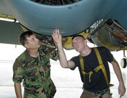 MINOT AIR FORCE BASE, N.D. – Col. Gary Lane, 5th Maintenance Group commander, inspects an engine of a B-52H Stratofortress with Senior Airman Lance Huffman, 5th Aircraft Maintenance Squadron. Colonel Lane will retire from the Air Force during a ceremony here June 15 after more than 35 years of service. (U.S. Air Force photo by Senior Airman Danny Monahan)