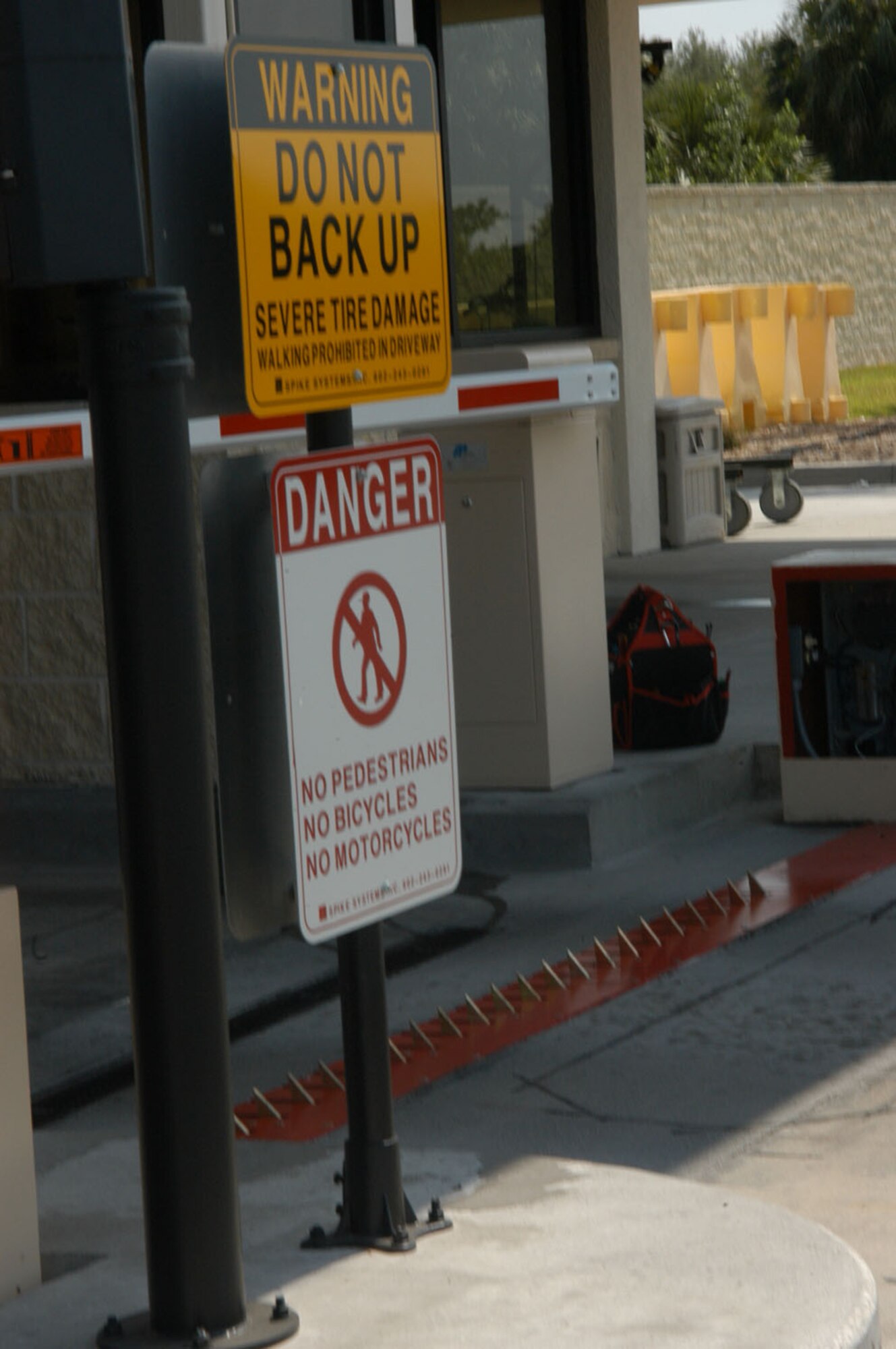 The signs at the Dale Mabry gate warn of tire shredders and drop barriers. The security measures were installed earlier this year by the 6th Civil Engineer and 6th Security Forces squadrons to make the base safer. (Air Force Photo by Airman 1st Class Latanya Reid)