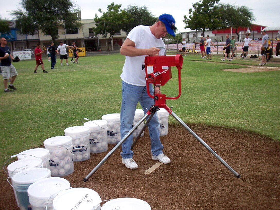 Senior Master Sgt. Tom Hren assembles a pitching machine that was donated to the Manta Baseball Academy in May in Ecuador. Sergeant Hren is assigned to the 190th Air Refueling Wing, which is deployed as part of the 478th Expeditionary Operations Squadron at Manta Forward Operation Location. (U.S. Air Force photo/Maj. Chris Hemrick)