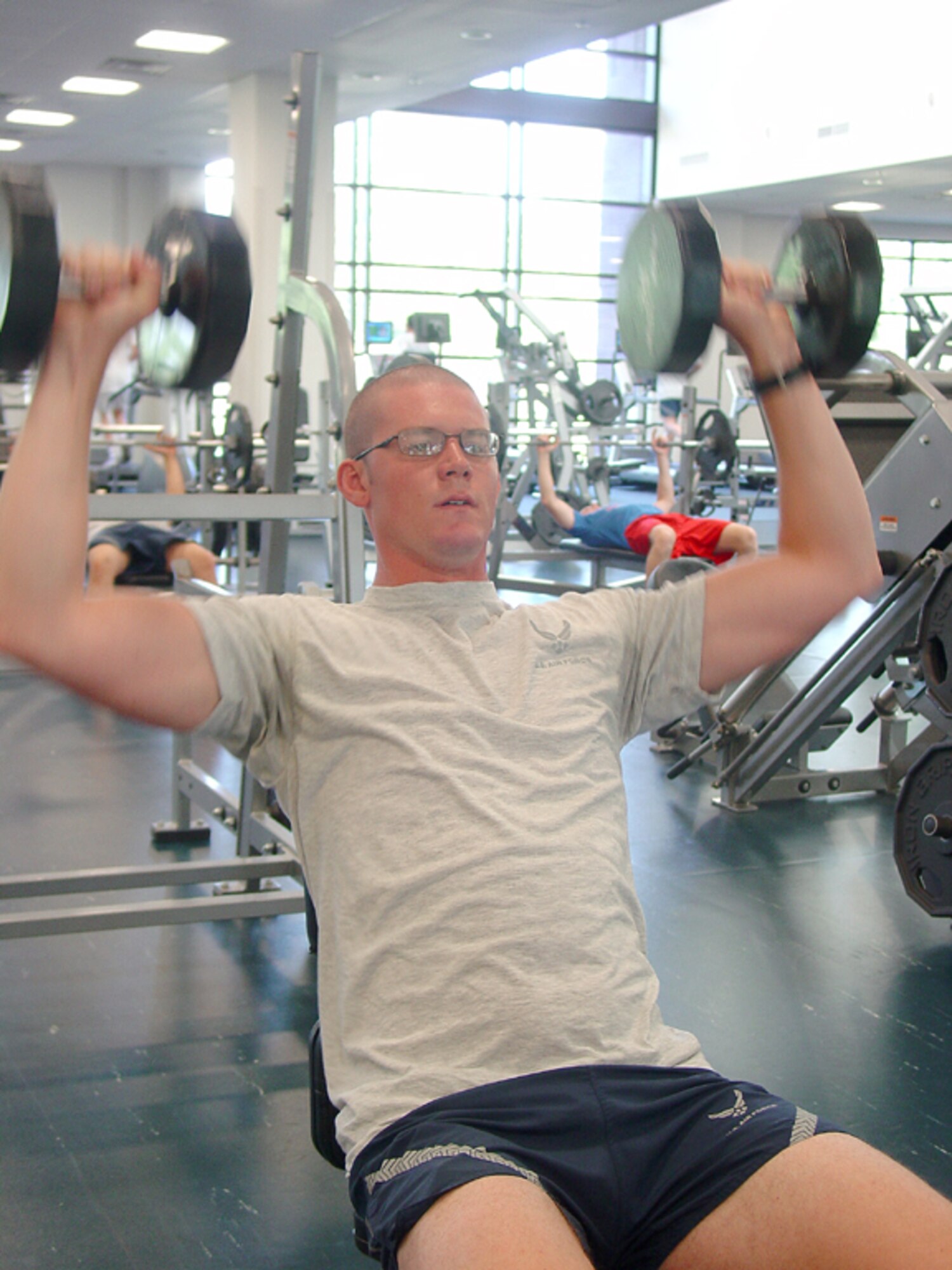 Senior Airman Brent Beckner, 817th Contingency Response Group Force Protection Flight member, gets “fit to fight” in the McGuire Fitness Center Thursday. The fitness center today begins a three-month trial of 24-hour operations Monday through Friday. The center will open at 5 a.m. Monday and remain open until 5 a.m. Saturday. Weekend hours will remain the same. Col. Rick Martin, 305th Air Mobility Wing commander, facilitated the trial, hoping to accommodate late-shift workers unable to visit the fitness center during its normal hours of operation.