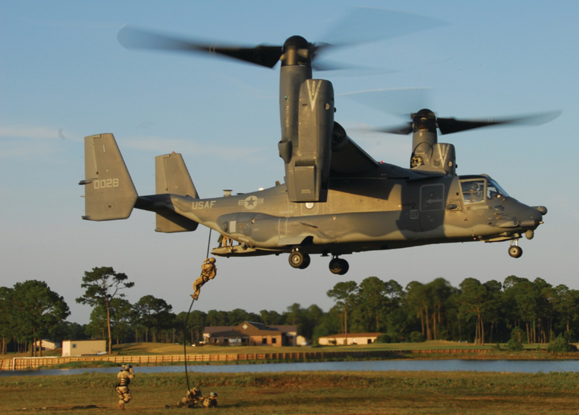 Special tactics Airmen from the 23rd Special Tactics Squadron, perform the first-ever fast rope from the CV-22 Osprey May 22. The Airmen fast roped from several different heights, to see how the manuever would be affected by the downdraft from a different aircraft. (U.S. Air Force photo by Chief Master Sgt. Gary Emery)