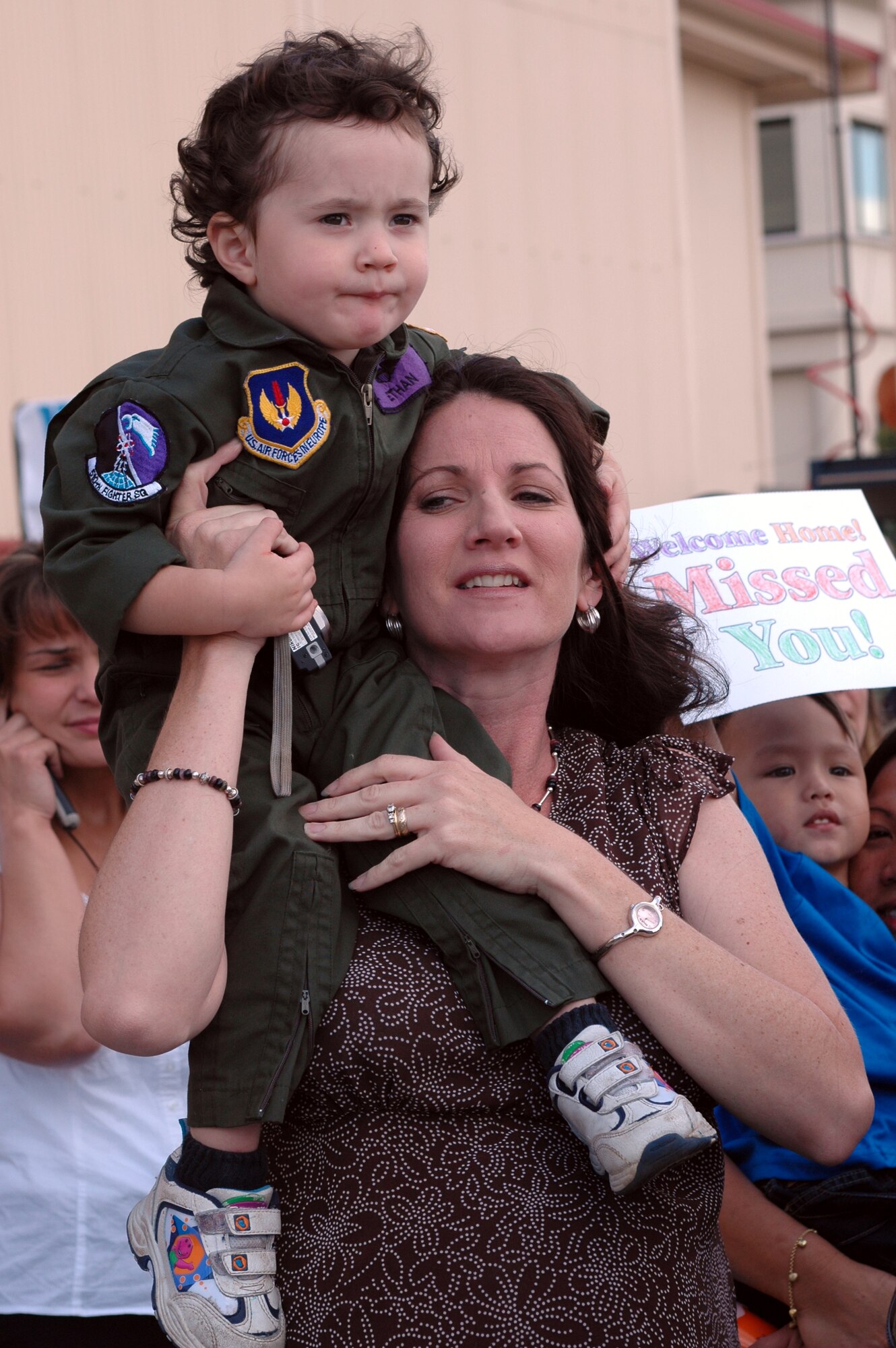 Darla Ratliff and  son, Ethan, wait for Capt. Casey Ratliff, 510th Fighter Squadron, to return. 
(U.S. Air Force photo by Senior Airman Sarah Gregory) 