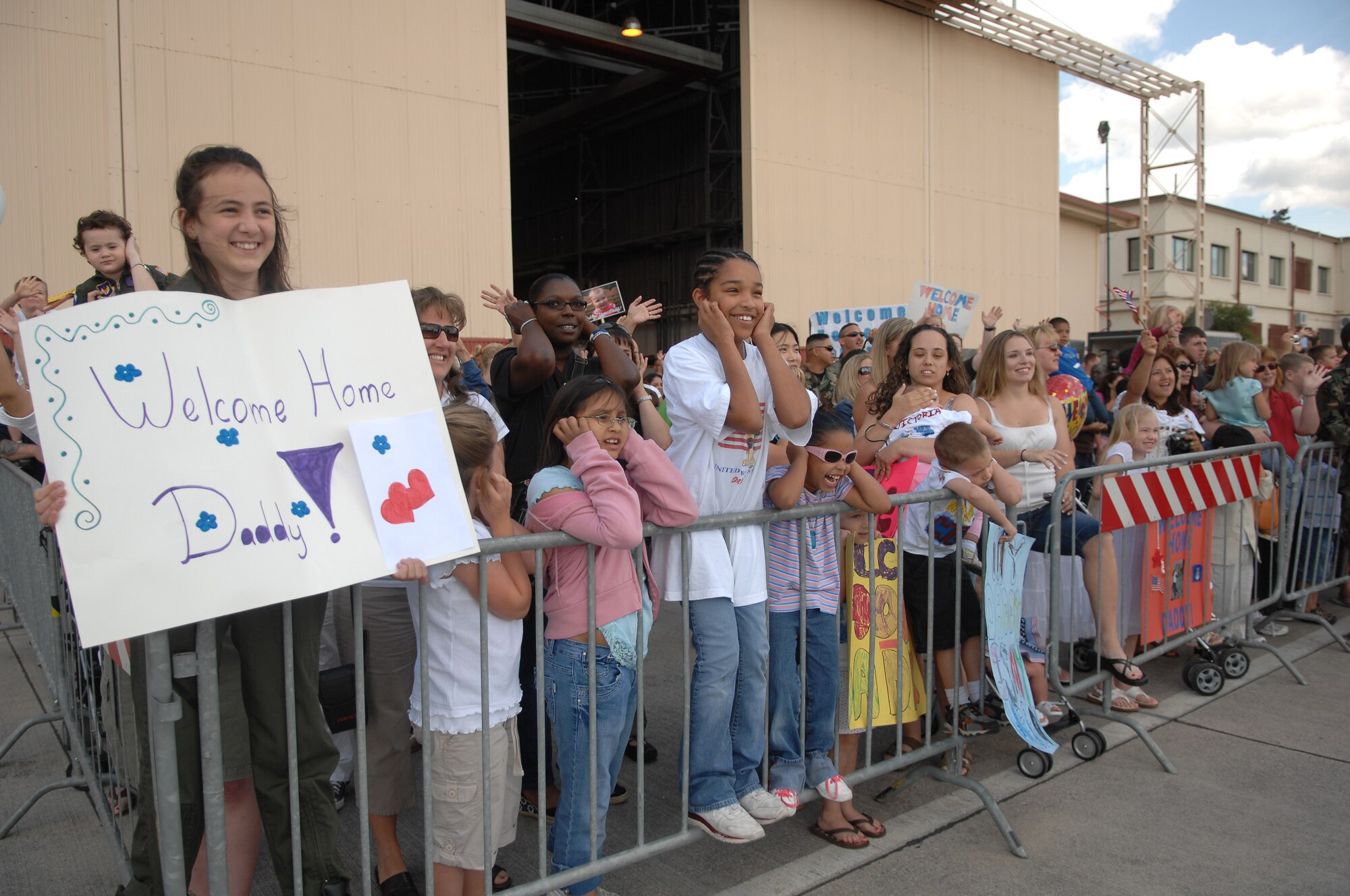 Friends and family wait to greet their loved ones returning from a deployment Wednesday. (U.S. Air Force photo by Staff Sgt. Bethann Caporaletti)