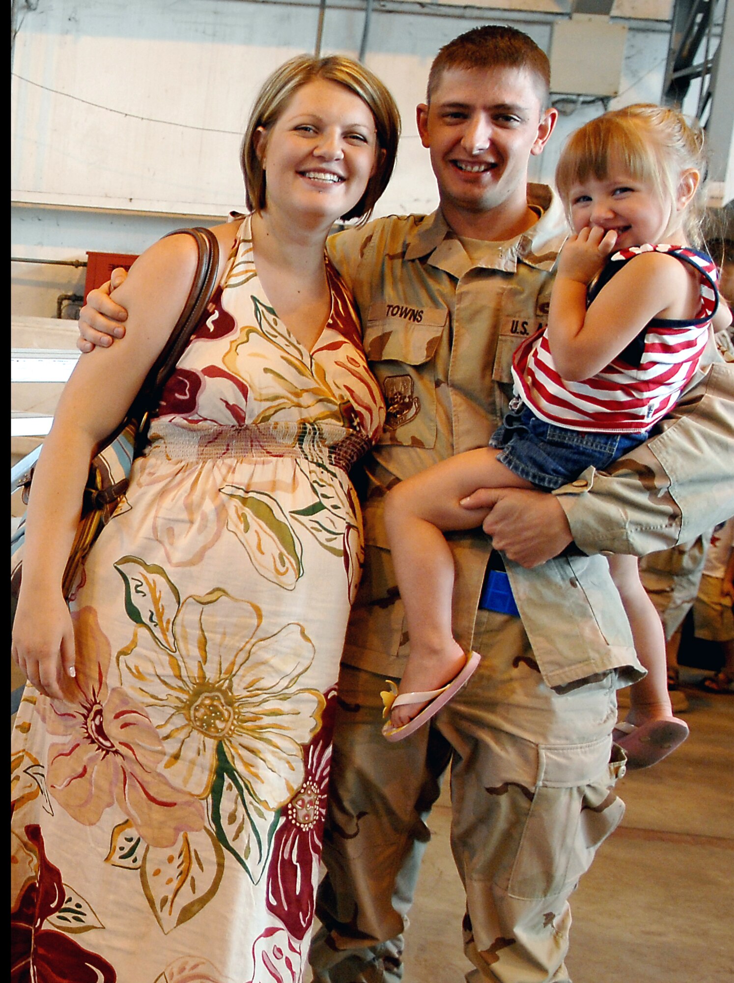 Staff Sgt. Zechary Towns, 31st Maintenance   Group, reunites with his wife, Ashley, and his daughter Gabby. (U.S. Air Force Photo by Staff Sgt. Bethann Caporaletti)