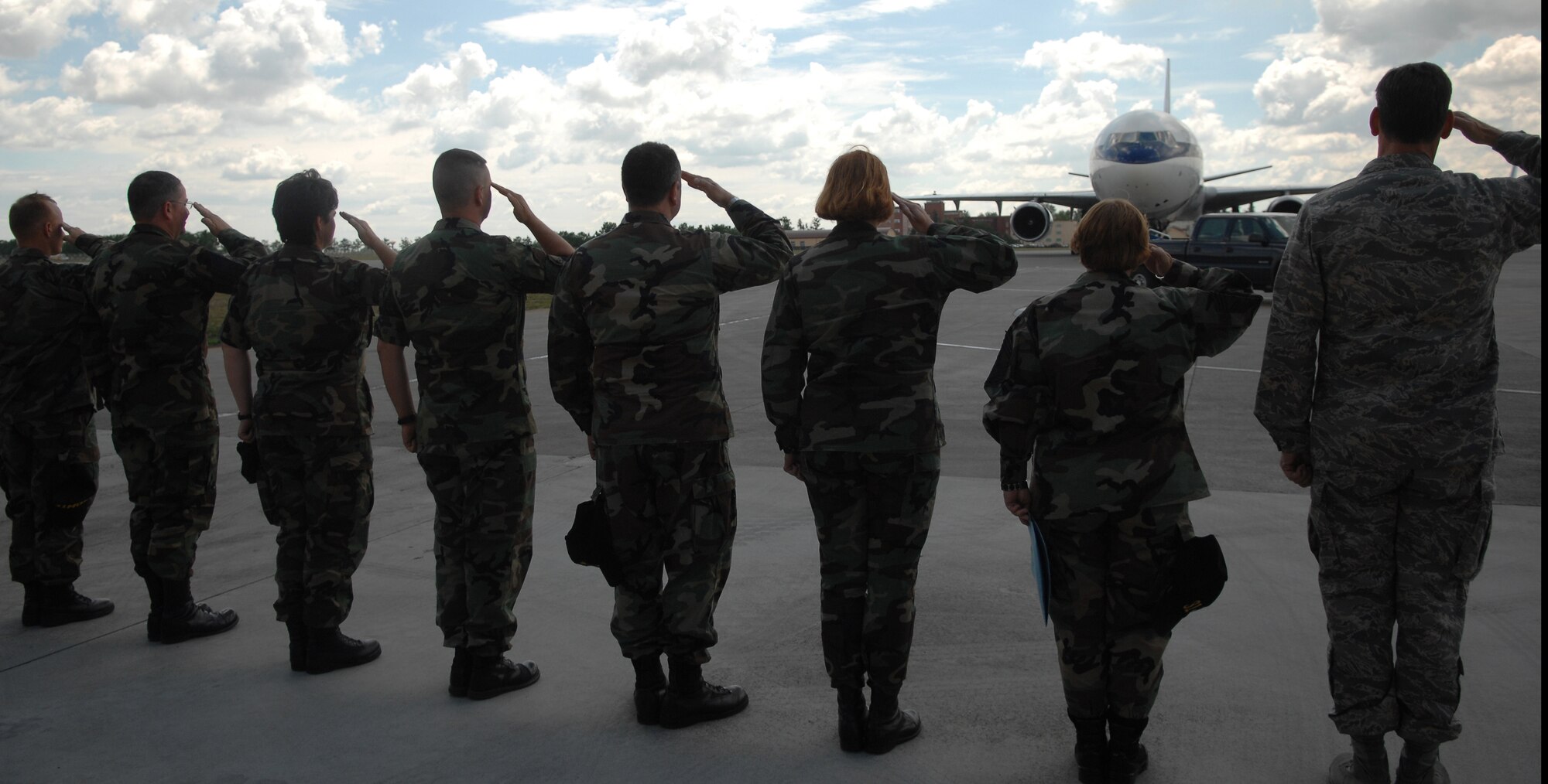 31st Fighter Wing leadership salutes the taxiing aircraft carrying Aerospace Expeditionary Force 5/6 returnees Wednesday. (U.S. Air Force Photo by Staff Sgt. Bethann Caporaletti)
