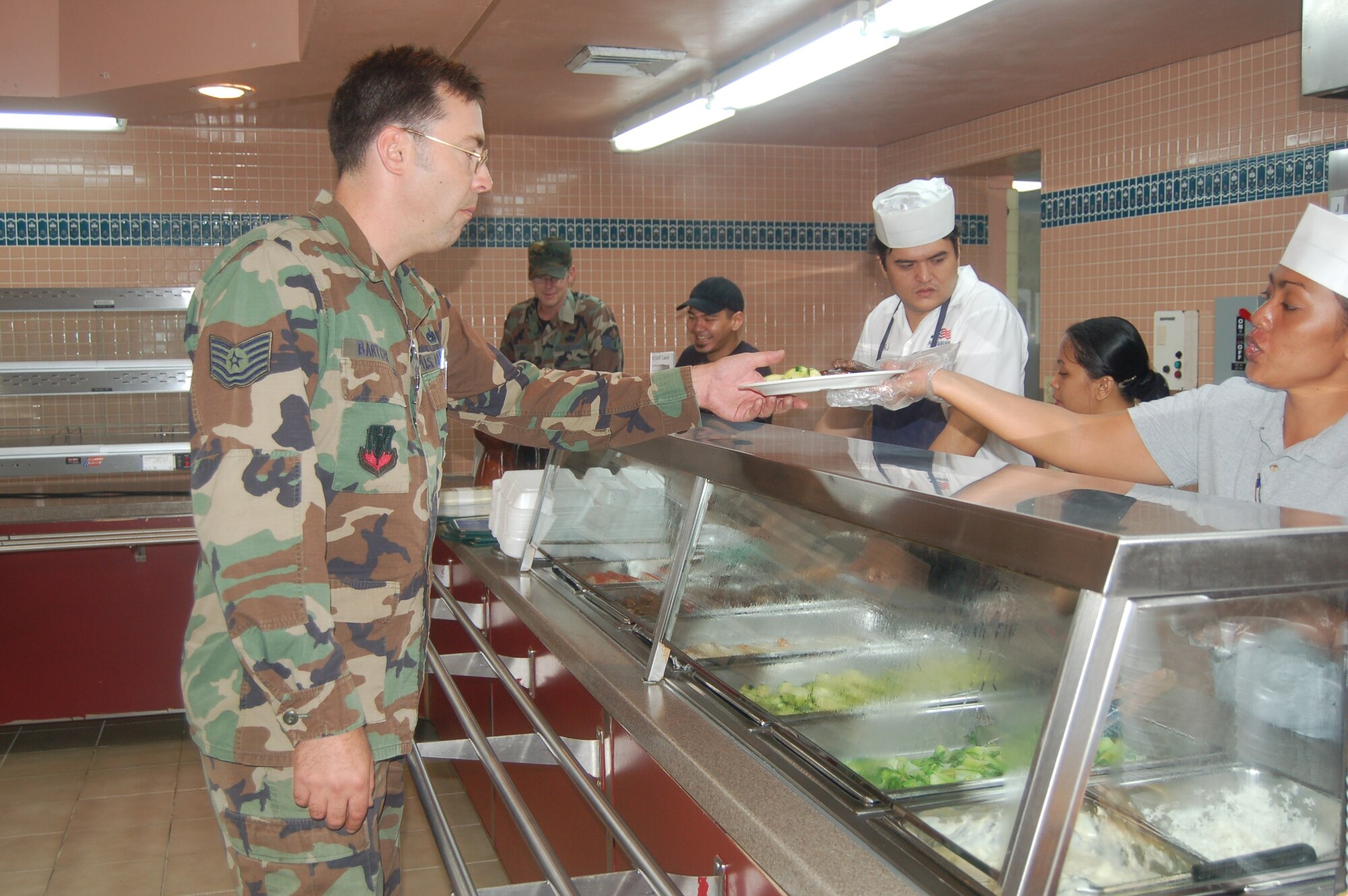 Tech. Sgt. Gregory Bartchy, from the 36th Expeditionary Maintenance Squadron, was one of the Airmen who took advantage of the appreciation meal sponsored by the Old Hagatna Grill May 24 at Andersen Air Force Base's dining facility, the Magellan Inn.  The Old Hagatna Grill hosted the meal for Airmen and their families May 24 to thank them for their service and share Guam dining options available off-base. (Photo by Airman 1st Class Carissa Morgan/The Pacific Edge)