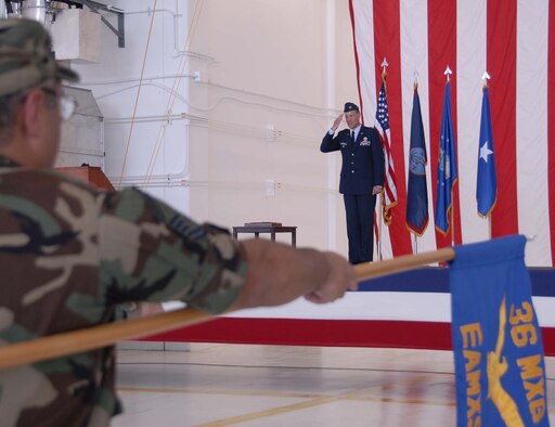 Senior Master Sgt. Mark Gonzales, lowers the 36th Maintenance Group’s guidon as Col. Bret Klassen assumes command May 24.  (Photo by Airman 1st Class Daniel Owen/36 CS)