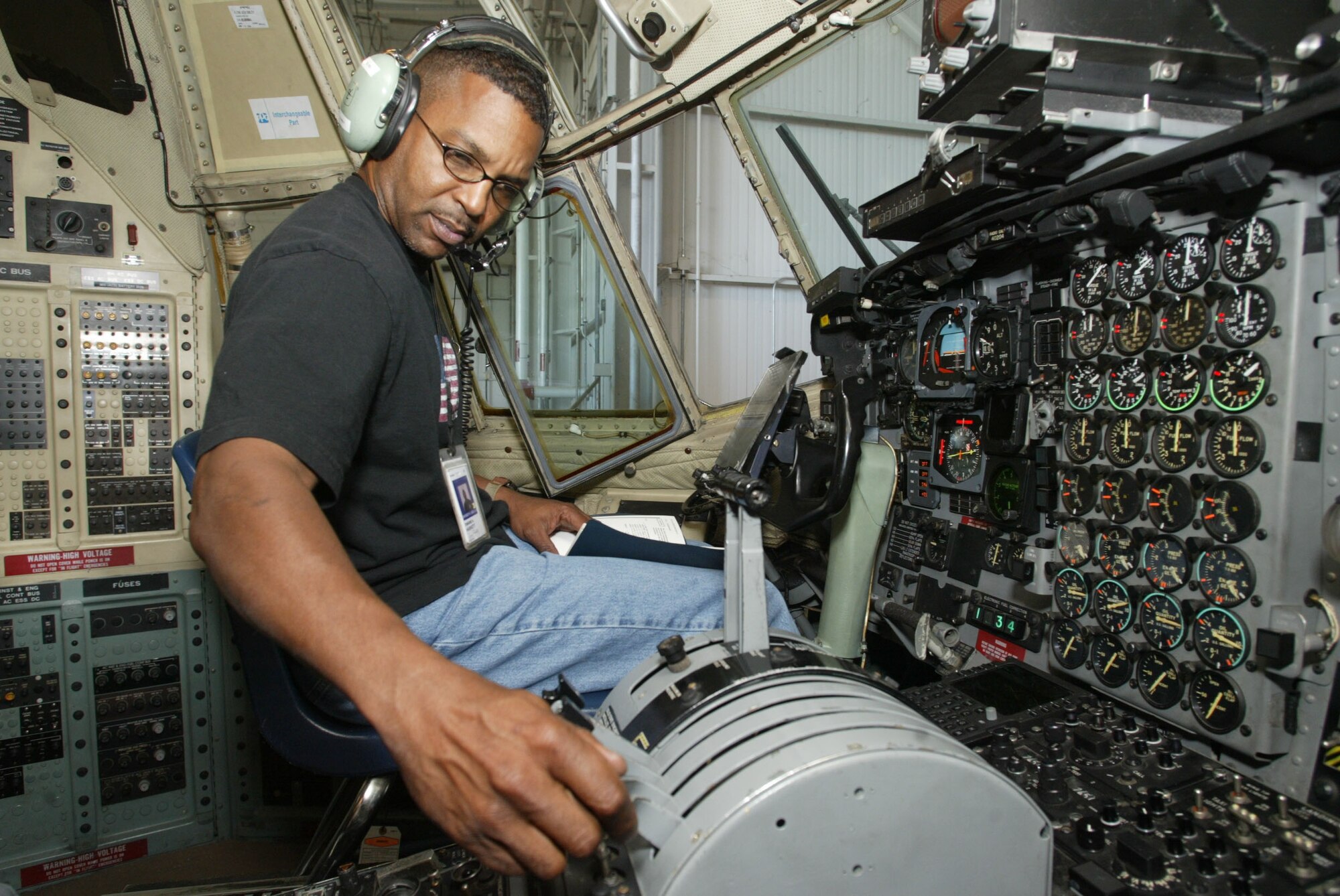 Tony Haskett, an avionics technician with the 94th Maintenance Squadron's avionics shop, checks engine data for tolerance and then provides the input data into the flight data recording system (the black box).