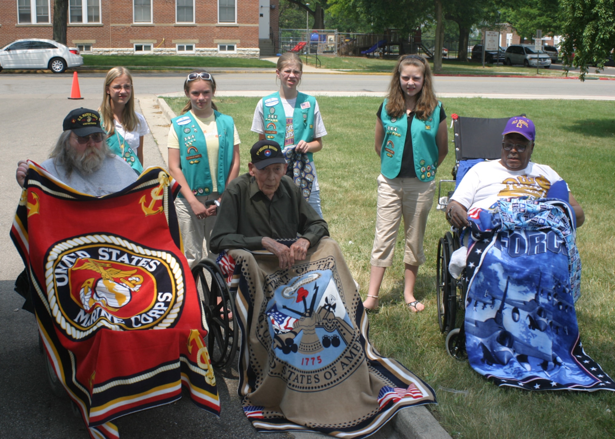 DAYTON,Ohio-- Veterans at the Dayton VA Medical Center are presented with blankets that were sewn by Girl Scout Troop 364 from Lima, Ohio. The Girl Scout Troop presented the veterans with more than 15 blankets and pillow cases that represented all four branches of the armed services. (U.S. Air Force photo/Master Sergeant Doug Moore) 