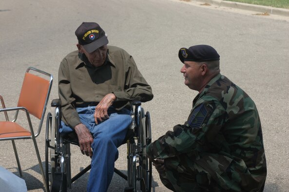 DAYTON, Ohio -- Chief Master Sergeant Bill Arehart, 445th Security Force Squadron, listens to Army veteran Staff Sergeant George Allen as he talks about storming of the beaches of Normandy on D-Day during World War II. (U.S. Air Force photo/Master Sergeant Doug Moore)