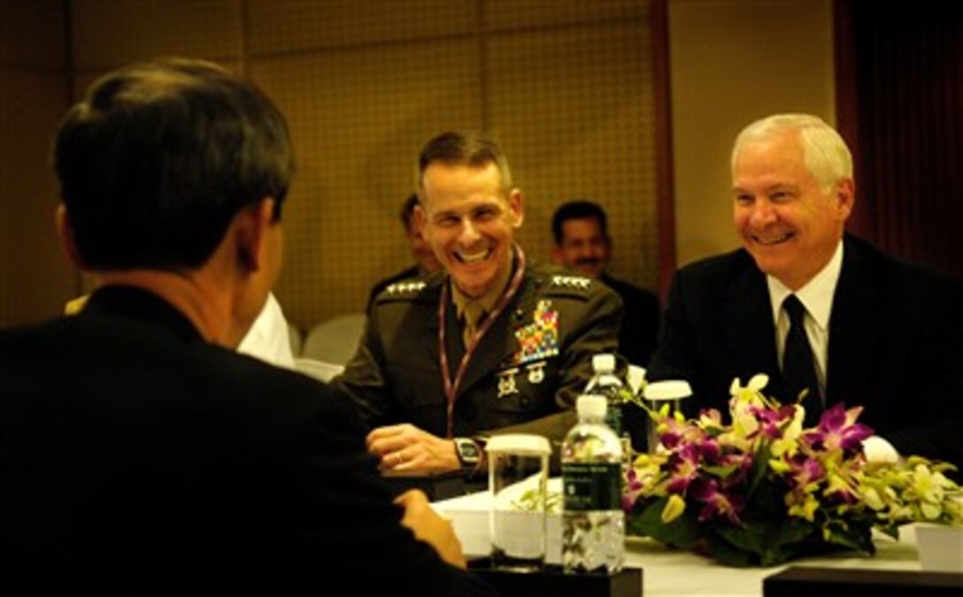 Defense Secretary Robert M. Gates and U.S. Marine Gen. Peter Pace, chairman of the Joint Chiefs of Staff, share a laugh with South Korean Minister of Defense Kim Jang-soo in Singapore, June 2, 2007.  Gates and Pace are in Singapore to attend the 6th International Institute for Strategic Studies conference, the Shangri-La Dialogue.