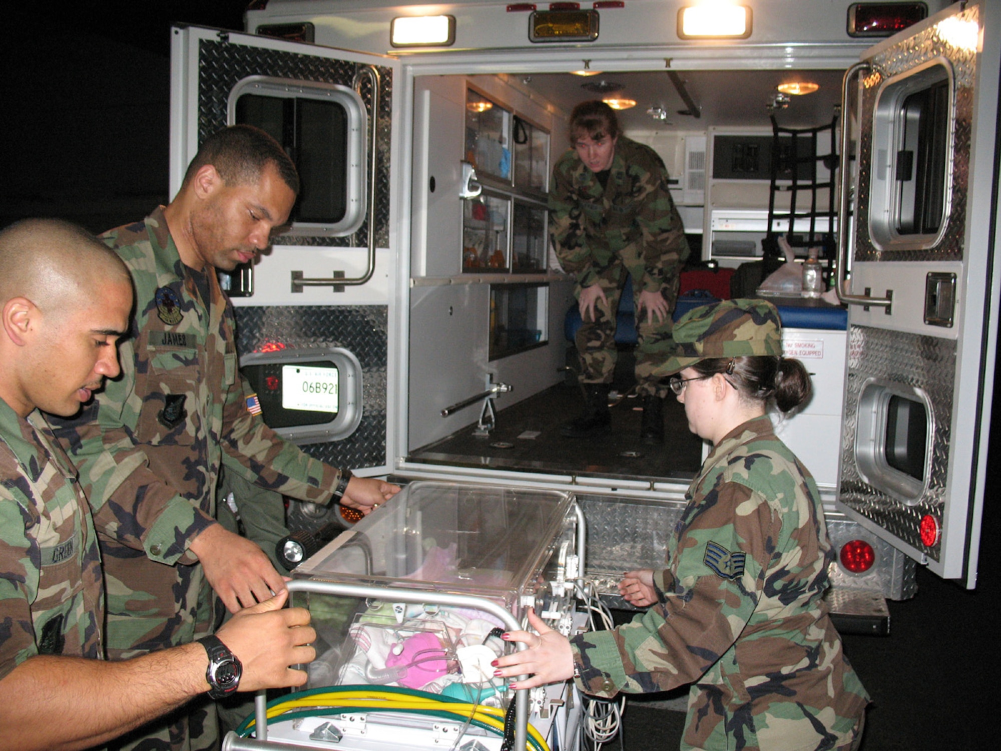 MISAWA AIR BASE, Japan -- Medical technicians prepare to load Maya Hegoas, premature newborn, on to an ambulance which ransported her to a C-17 for evacuation in early May. Maya's premature conditions requires she have an oxygen and feeding tube during the trip from Japan to Washington state. (U.S. Navy photo by Petty Officer 1st Class Hendrick Simoes)