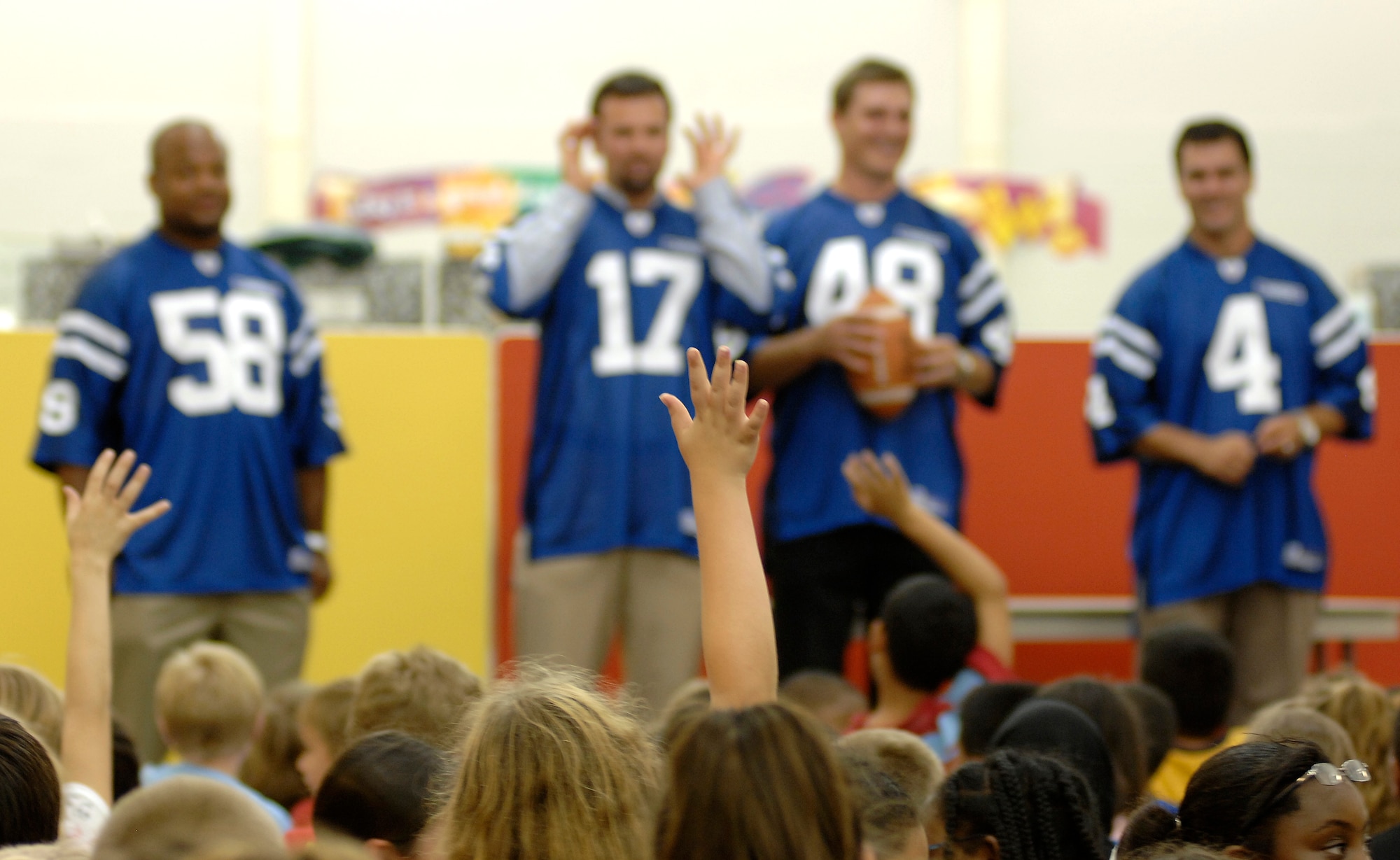 Indianapolis Colts (from left to right) Gary Brackett, Hunter Smith, Justin Snow and Adam Vinatieri answer questions at Randolph Elementary School on Randolph Air Force Base, Texas, June 1. The team members spent the day visiting with base personnel and school children, enhancing the already strong relationship between the team and the Air Force.  (U.S. Air Force photo/Staff Sgt. Brian Ferguson)
