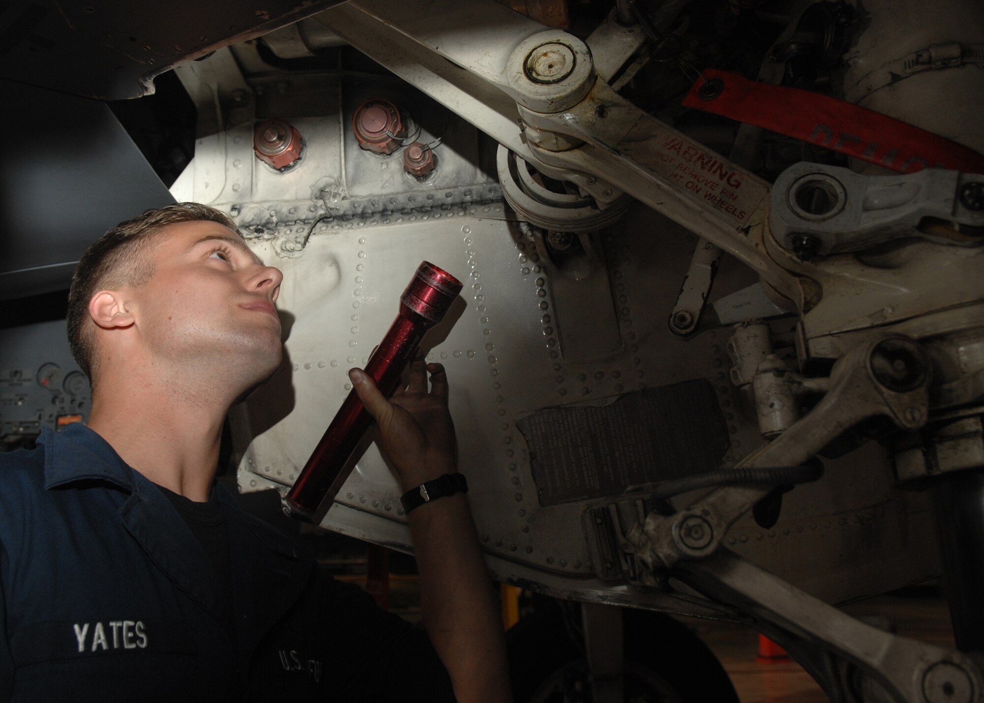 SEYMOUR JOHNSON AIR FORCE BASE, N.C. - Airman 1st Class John Yates, 336th Aircraft Maintenance Unit, inspects hydraulic lines on a F-15E Strike Eagle, May 30. The 4th Fighter Wings mission requires that the Strike Eagles are ready to deliver air power on target, on time whenever America calls. Therefore Airmen of the 4th Maintenance Group maintain these jets 24 hours per day. (U.S. Air Force photo by Senior Airman Jessica Klingler)