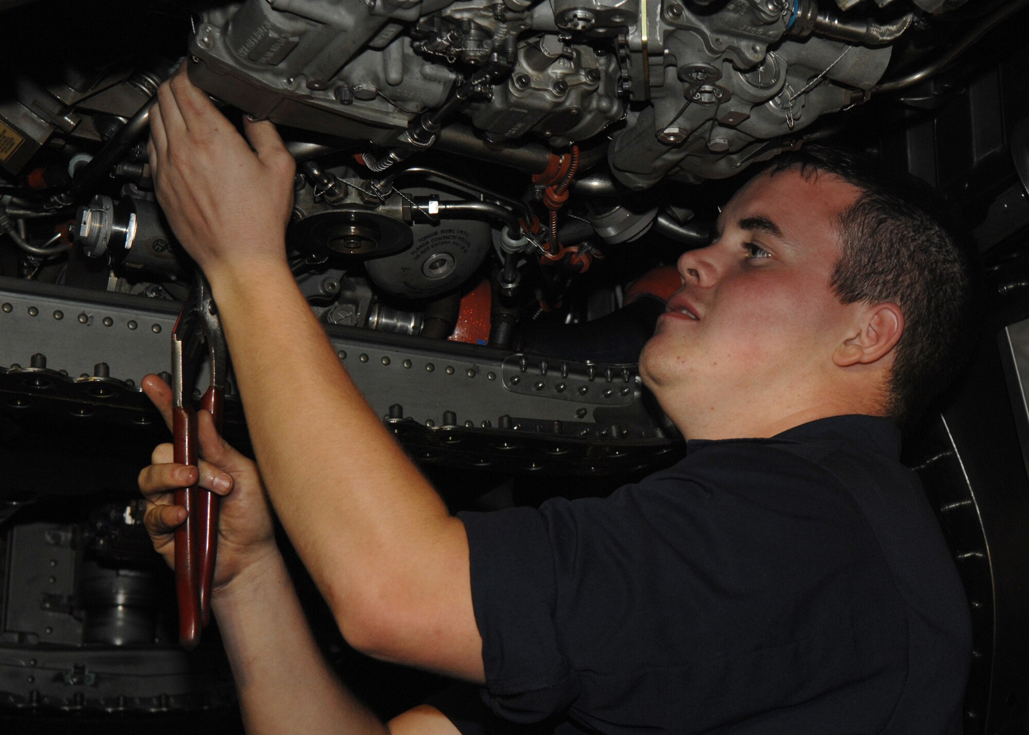 SEYMOUR JOHNSON AIR FORCE BASE, N.C. -  Senior Airman Steven Rigg performs routine maintenance on a F-15E Strike Eagle, May 30. The 4th Fighter Wings mission requires that the Strike Eagles are ready to deliver air power on target, on time whenever America calls. Therefore Airmen of the 4th Maintenance Group maintain these jets 24 hours per day. (U.S. Air Force photo by Senior Airman Christine Fortin)