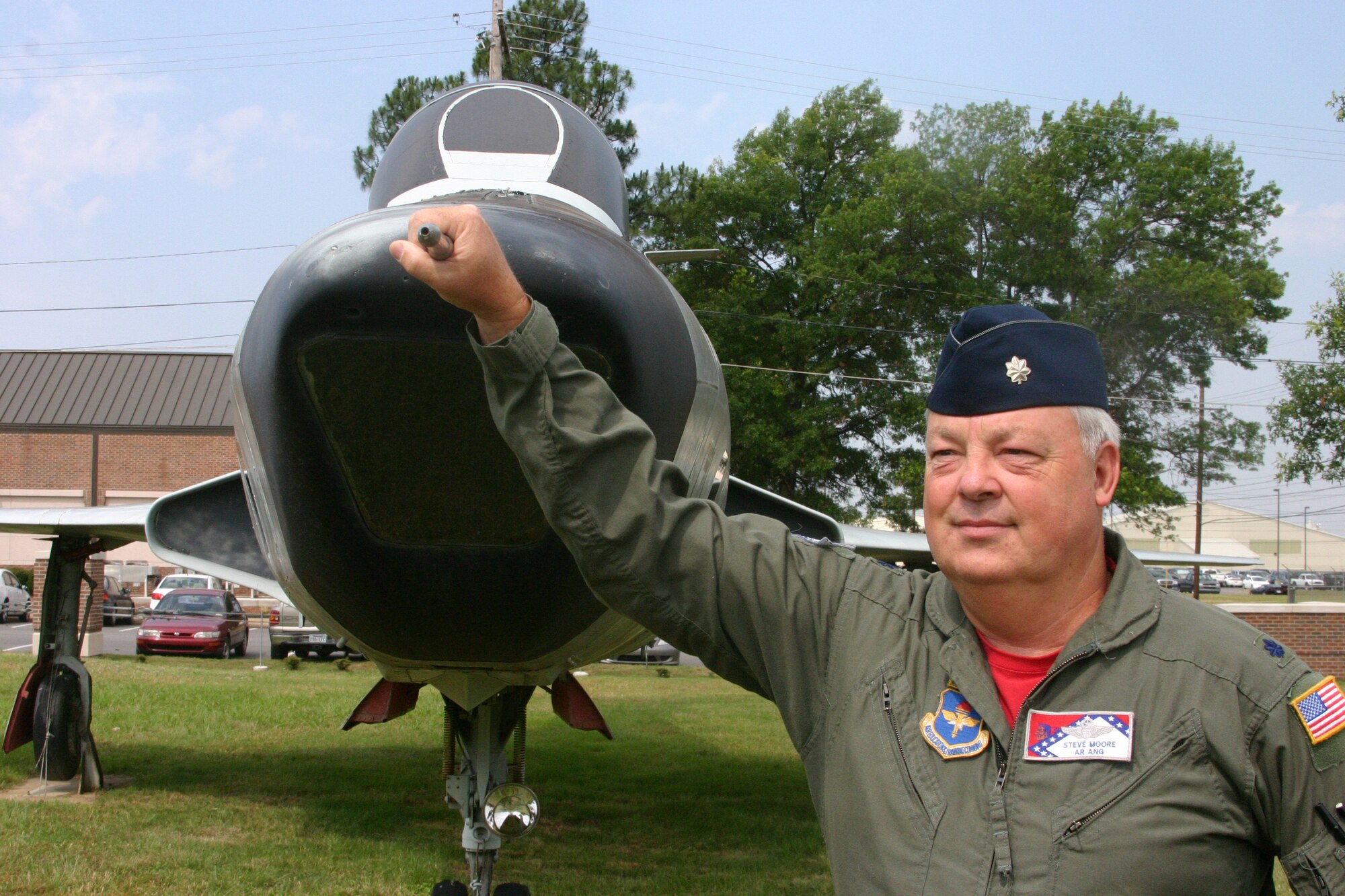 Lt. Col. Steve “Big Dog” Moore and one of the RF-101 Voodoo aircraft he flew during a 36-year Air National Guard career. (U.S. Air Force photo by Master Sgt. Bob Oldham)