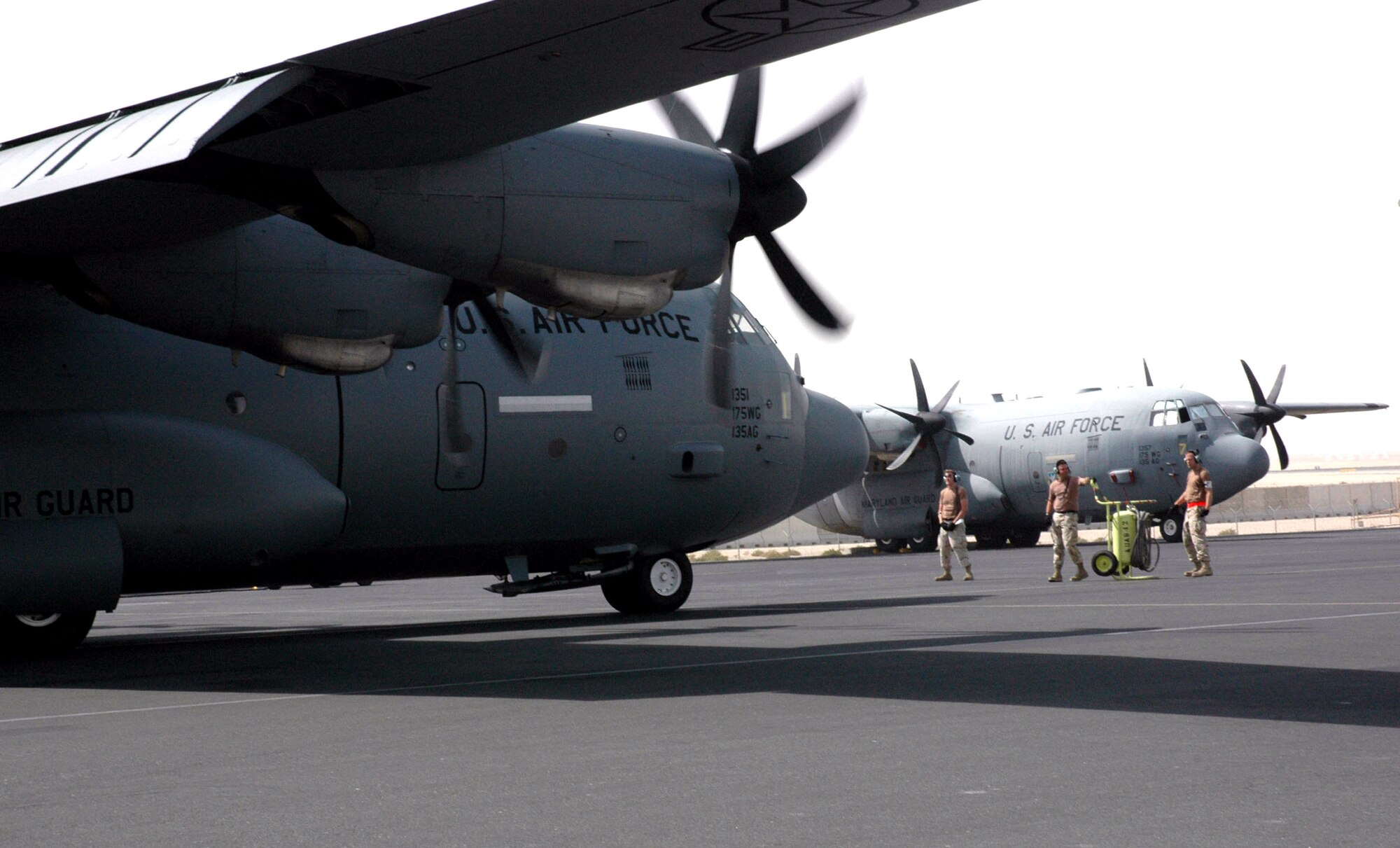 Two C-130 Hercules aircraft spin up for a mission June 2 at a base in Southwest Asia. Coalition C-130s and C-17 Globemaster IIIs flew 145 airlift sorties June 2 and delivered more than one million pounds of cargo. Airlift provided intra-theater heavy airlift support, helping to sustain operations throughout Afghanistan, Iraq and the Horn of Africa. (U.S. Air Force photo)