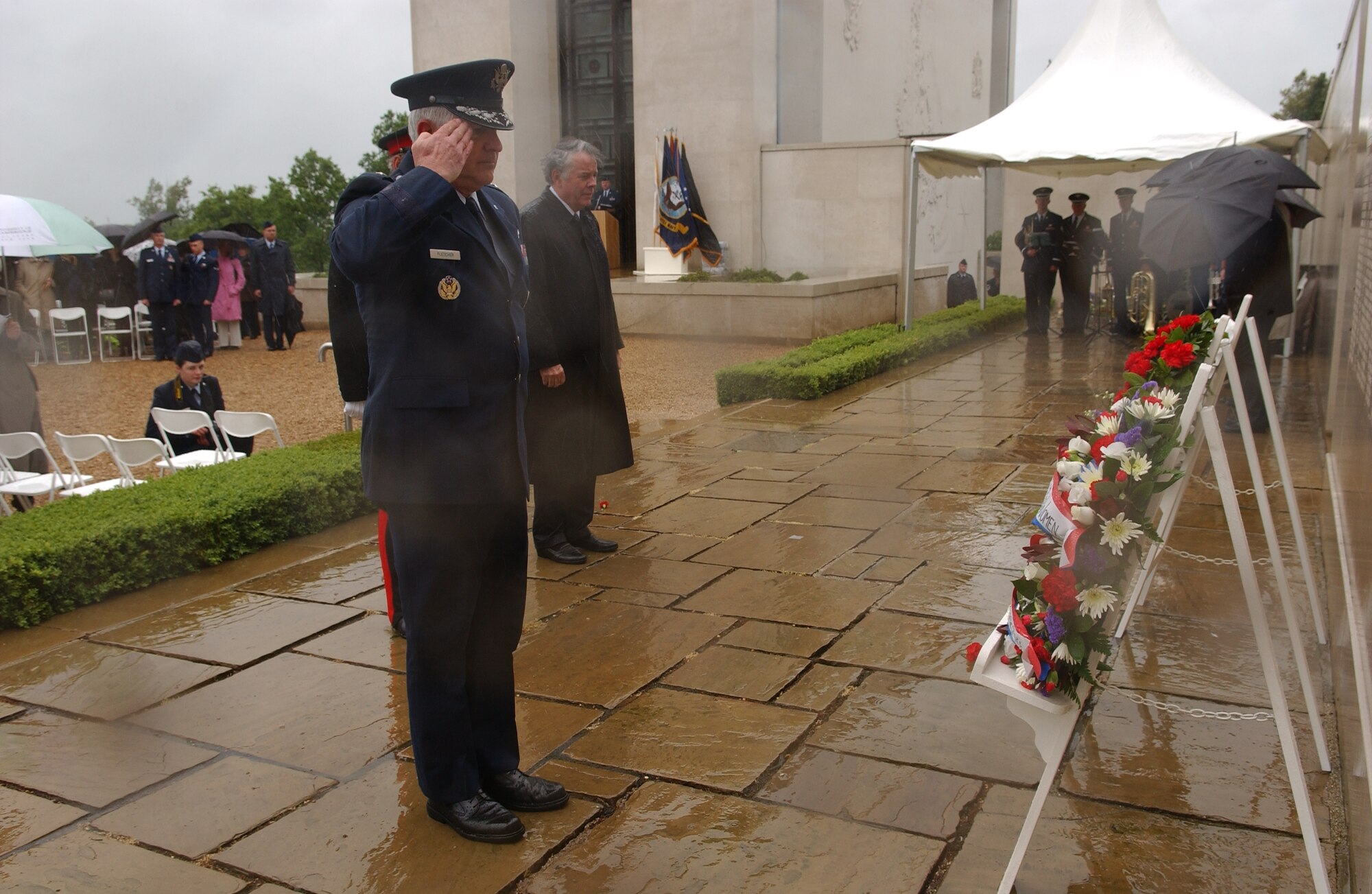 Maj. Gen. Paul Fletcher, 3rd Air Force commander salutes after presenting a wreath on behalf of the men and women of the U.S. Air Force, during the annual Memorial Day ceremony at the World War II American Cemetery in Cambridge, England, May 28, 2007. (Air Force photo by Tech. Sgt. Tracy L. DeMarco)