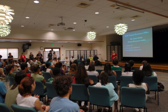 Laura Hobbs, from the NAF Resources Office at Kadena Air Base, Japan, talks to teens and parents about volunteer and job opportunities available during the summer vacation at the teen town hall meeting June 2.
(U.S. Air Force/Airman 1st Class Kasey Zickmund)