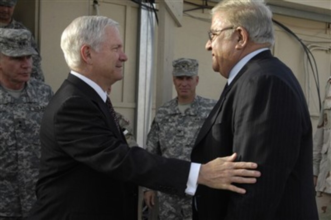 Secretary of Defense Robert M. Gates speaks with Afghan Minister of Defense Gen. Abdul Rahim Wardak during a visit to Kandahar Air Field, Afghanistan, June 4, 2007.  