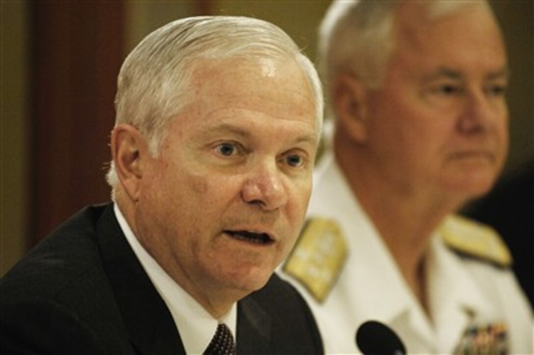 Secretary of Defense Robert M. Gates (left) answers a reporter's question during a press conference in Singapore on June 2, 2007.  Chairman of the Joint Chiefs of Staff Gen. Peter Pace (not pictured), U.S. Marine Corps, and Commander of U.S. Pacific Command Adm. Tim Keating (right), U.S. Navy, joined Gates at the press conference.  Gates, Pace and Keating are in Singapore to attend the 6th International Institute for Strategic Studies conference, the Shangri-La dialogue.  