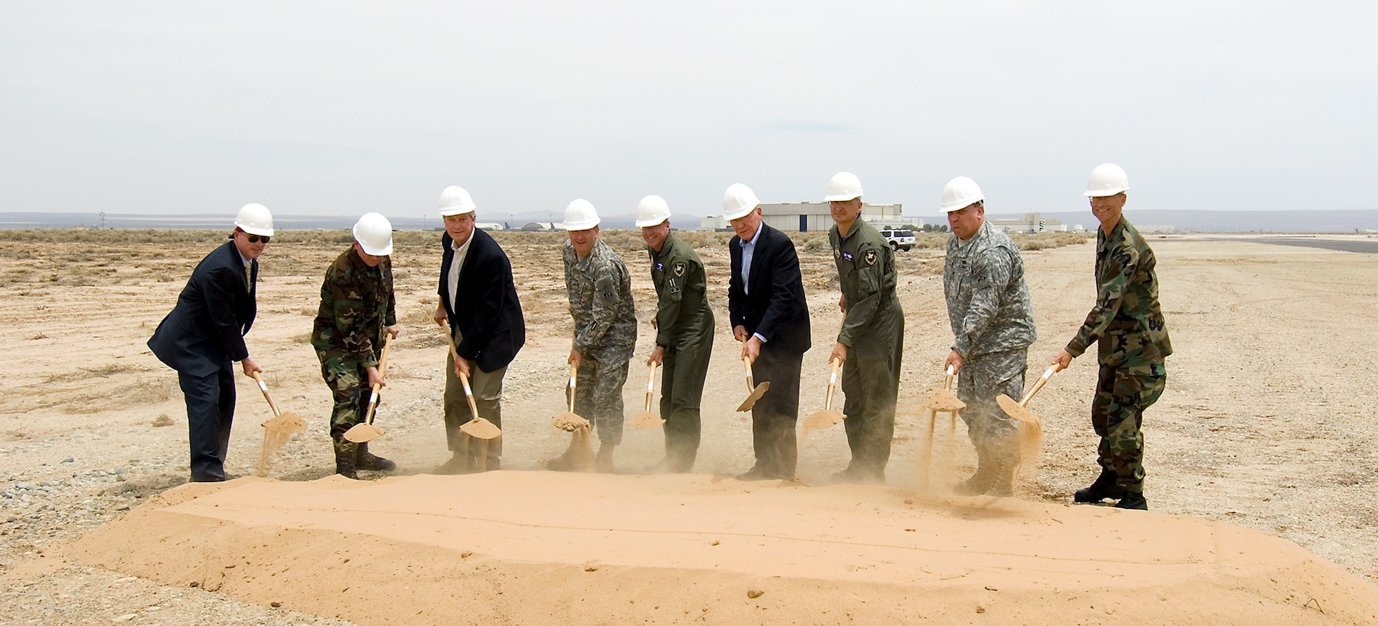 Edwards leadership, the U.S. Army Corps of Engineers and guests shovel dirt during a groundbreaking ceremony June 1 marking the beginning of a new runway project here. (Photo by Mike Cassidy)