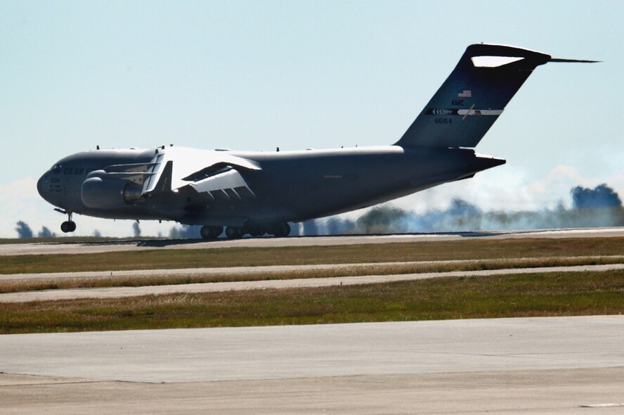 Air Force and local community members watch, as the newest C-17 to be stationed at Travis Air Force Base, Calif. touches down. USAF Photo by Nan Wylie