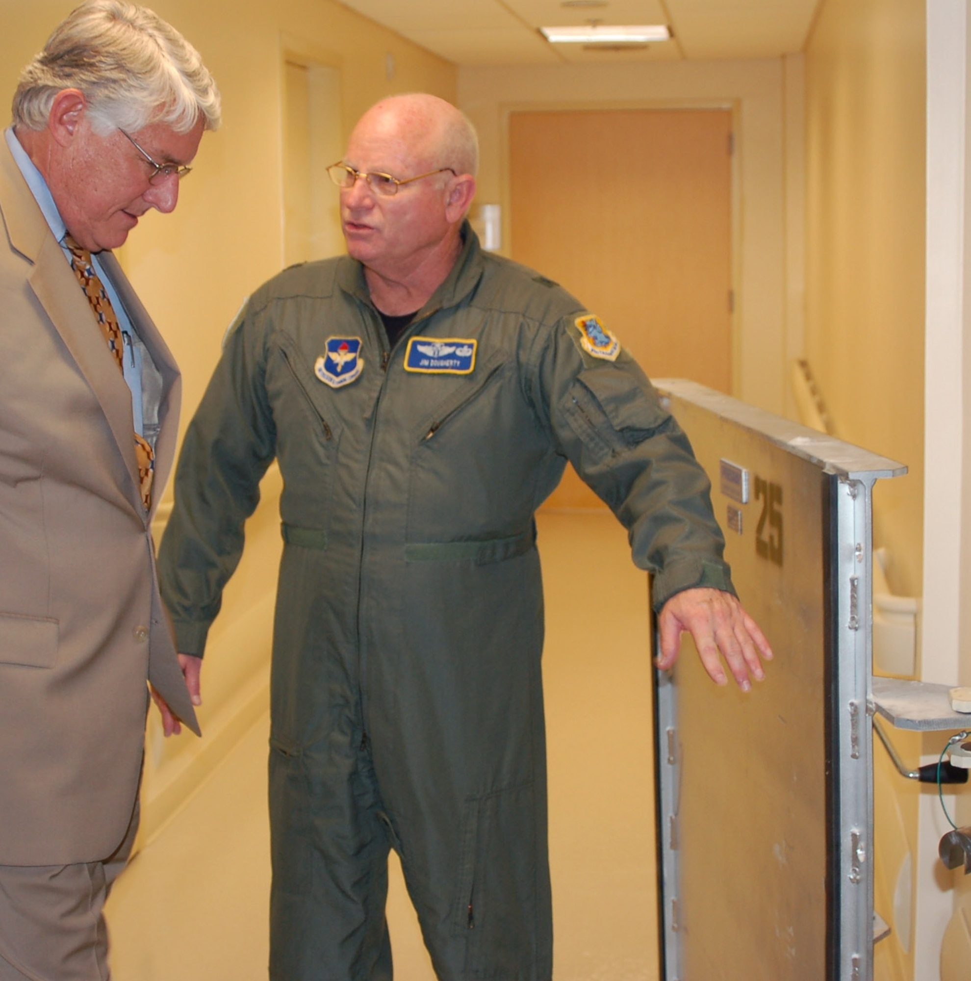 Dr. Jones is shown Keesler Medical Center’s flood doors by Brig. Gen. (Dr.) James Dougherty, 81st Medical Group commander, during a tour of the medical center May 31.   (U.S. Air Force photo by Steve Pivnick)