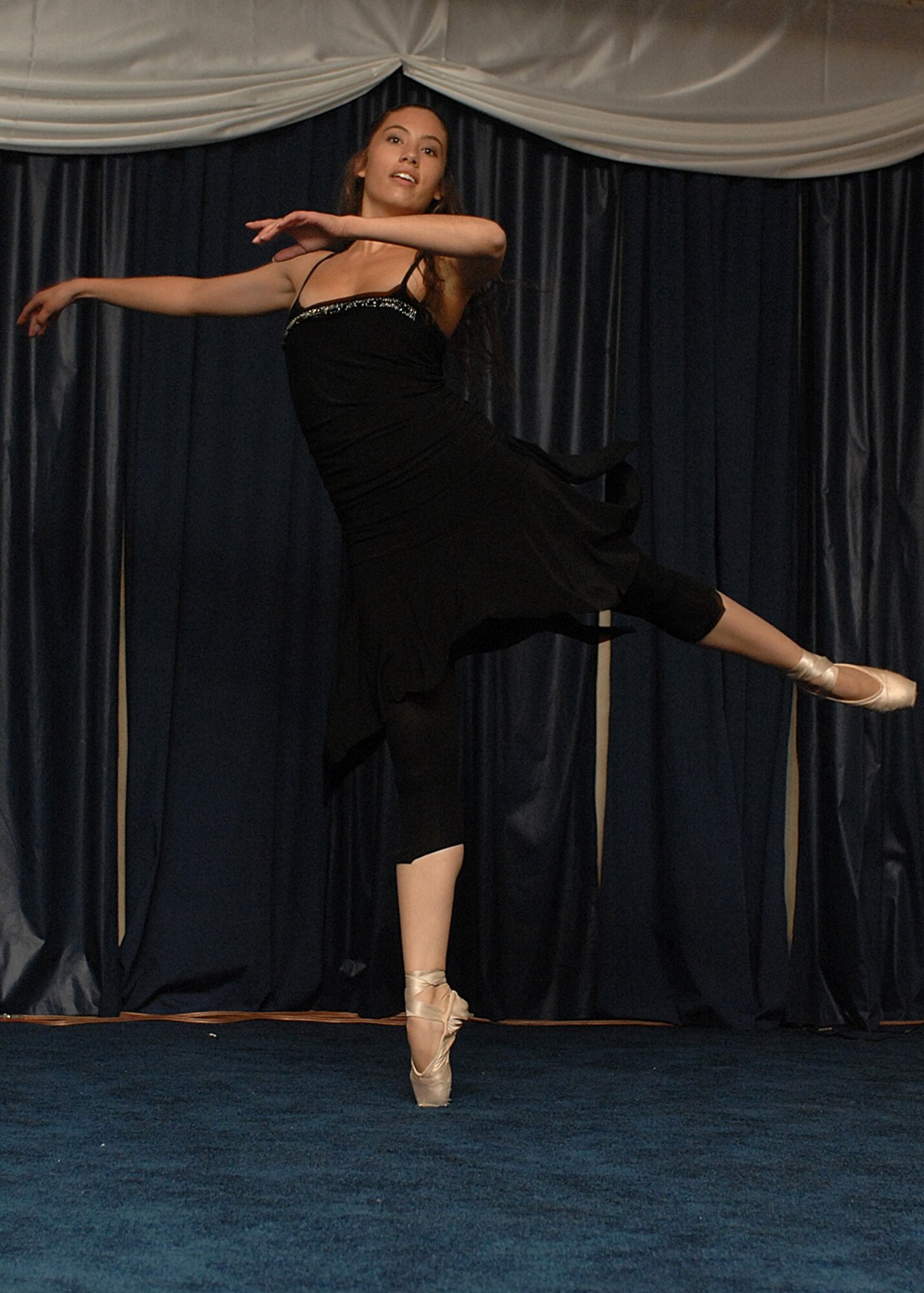 Tiffany Armijo, a dependent, does a contemporary ballet sequence in front of more than 400 audience members at Holloman Idol. (U.S. Air Force photo/Airman 1st Class John Strong)