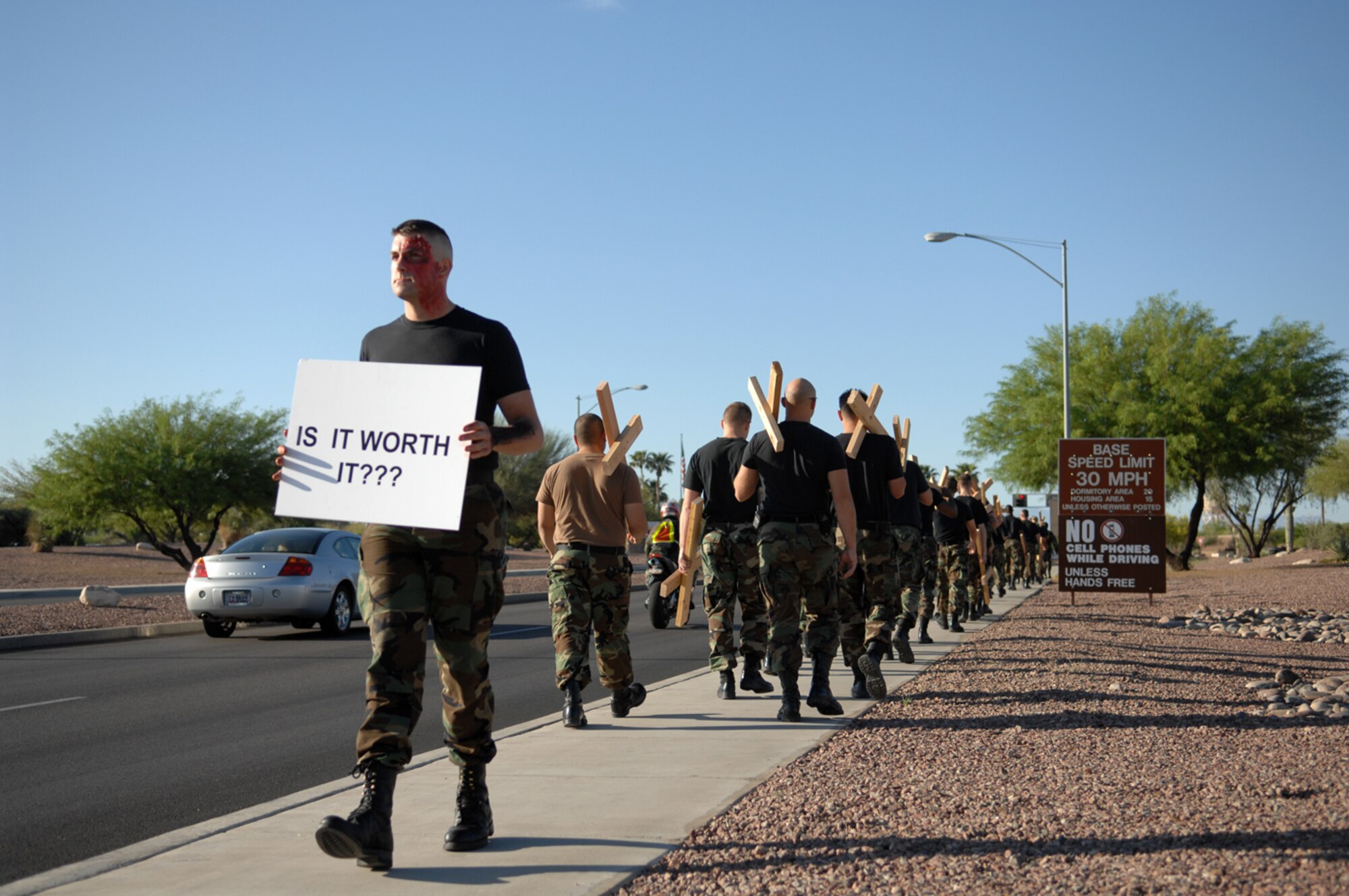 Forty-five D-M Airmen volunteered May 4 to help increase safety awareness during the 2007 101 Critical Days of Summer campaign. The Airmen walked along Craycroft Road on base carrying signs discouraging speeding, along with crosses to symbolize every traffic-related fatality in the Air Force so far this year.