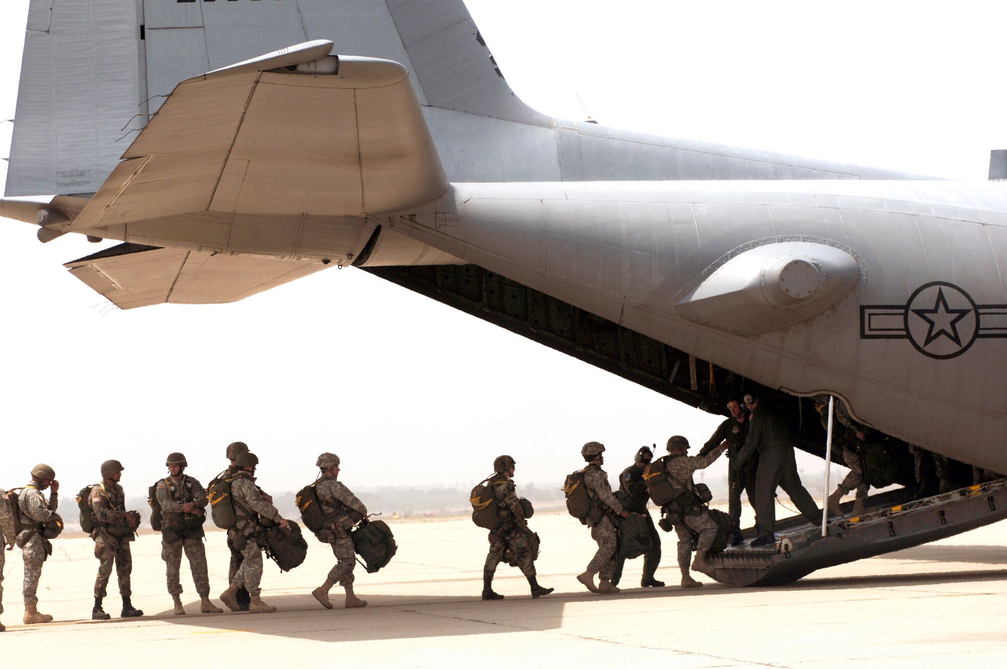 Army Reserve Soldiers from the 426th Civil Affairs Battalion's Bravo Company at Upland, Calif., load a C-130 Hercules June 2 in preparation for an airdrop in support of the weeklong exercise Operation Hydra. Operation Hydra provides realistic training scenarios, exercising the 615th Contingency Response Wing's ability to conduct expeditionary mobility operations at three locations. The wing is practicing its "open an air base" concept while maintaining command and control of in-theater operations. (U.S. Air Force photo/Staff Sgt. Sarayuth Pinthong)