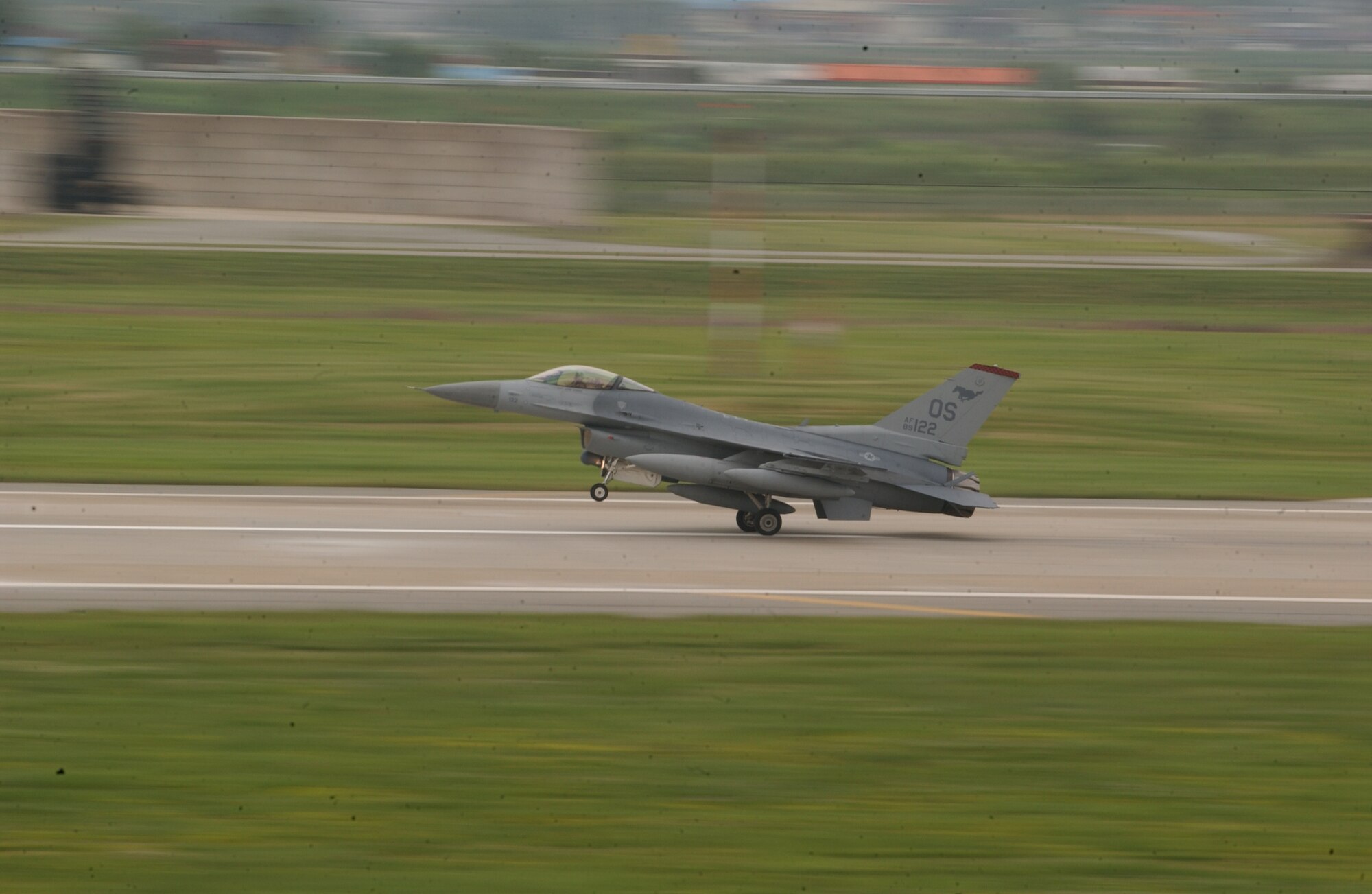 OSAN AIR BASE, Republic of Korea -- An F-16 Fighting Falcon from the 36th Fighter Squadron returns here today after a temporary deployment to Kunsan AB during repairs and maintenance to the air field. (U.S. Air Force photo by Airman Jason Epley)