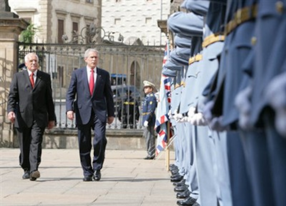 President George W. Bush joins Czech President Vaclav Klaus during the review of the Czech troops at Prague Castle in the Czech Republic, June 5, 2007. 