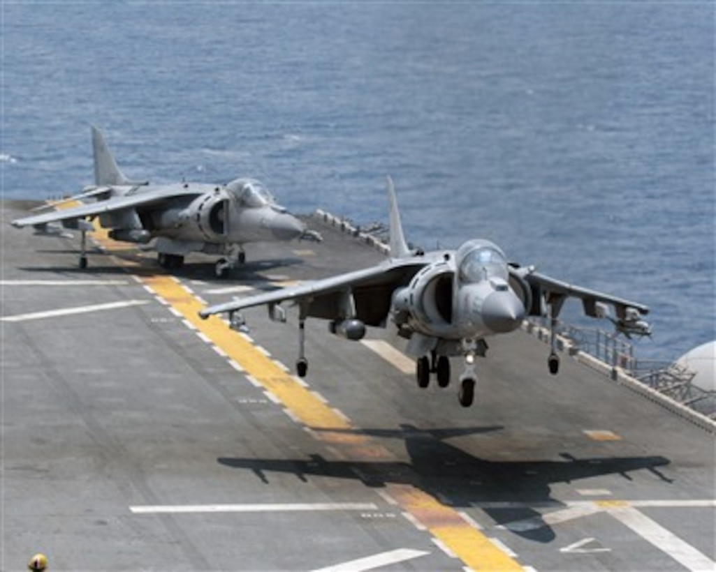 A U.S. Marine Corps AV-8B Harrier II aircraft hovers over the deck before touching down aboard the USS Kearsarge (LHD 3) during a composite unit training exercise in the Atlantic Ocean on May 22, 2007. The Harrier is attached to Marine Medium Helicopter Squadron 261, which will deploy as the aviation combat element for the 22nd Marine Expeditionary Unit.  