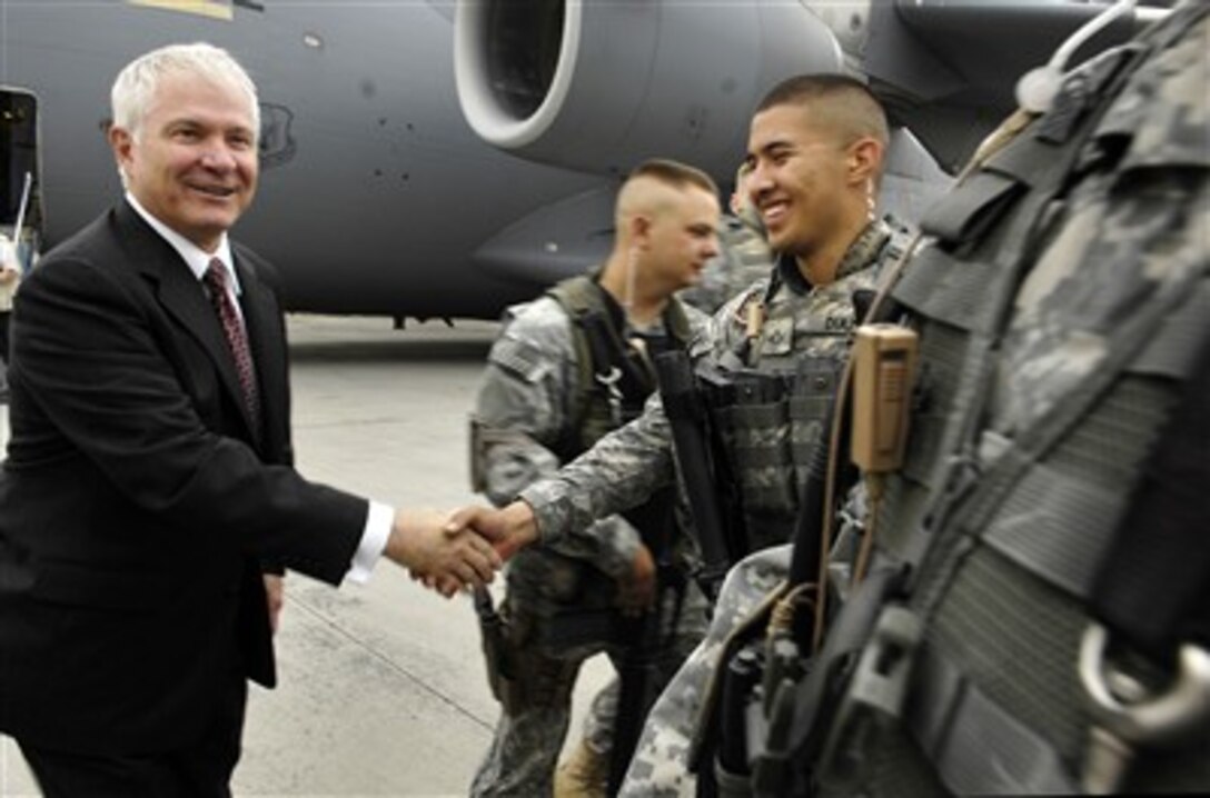 Secretary of Defense Robert M. Gates shakes hands with a U.S. Army soldier at the airport in Kabul, Afghanistan, on June 4, 2007.  Gates is in Afghanistan to meet with Afghan President Hamid Karzai and senior U.S military leaders deployed there.  