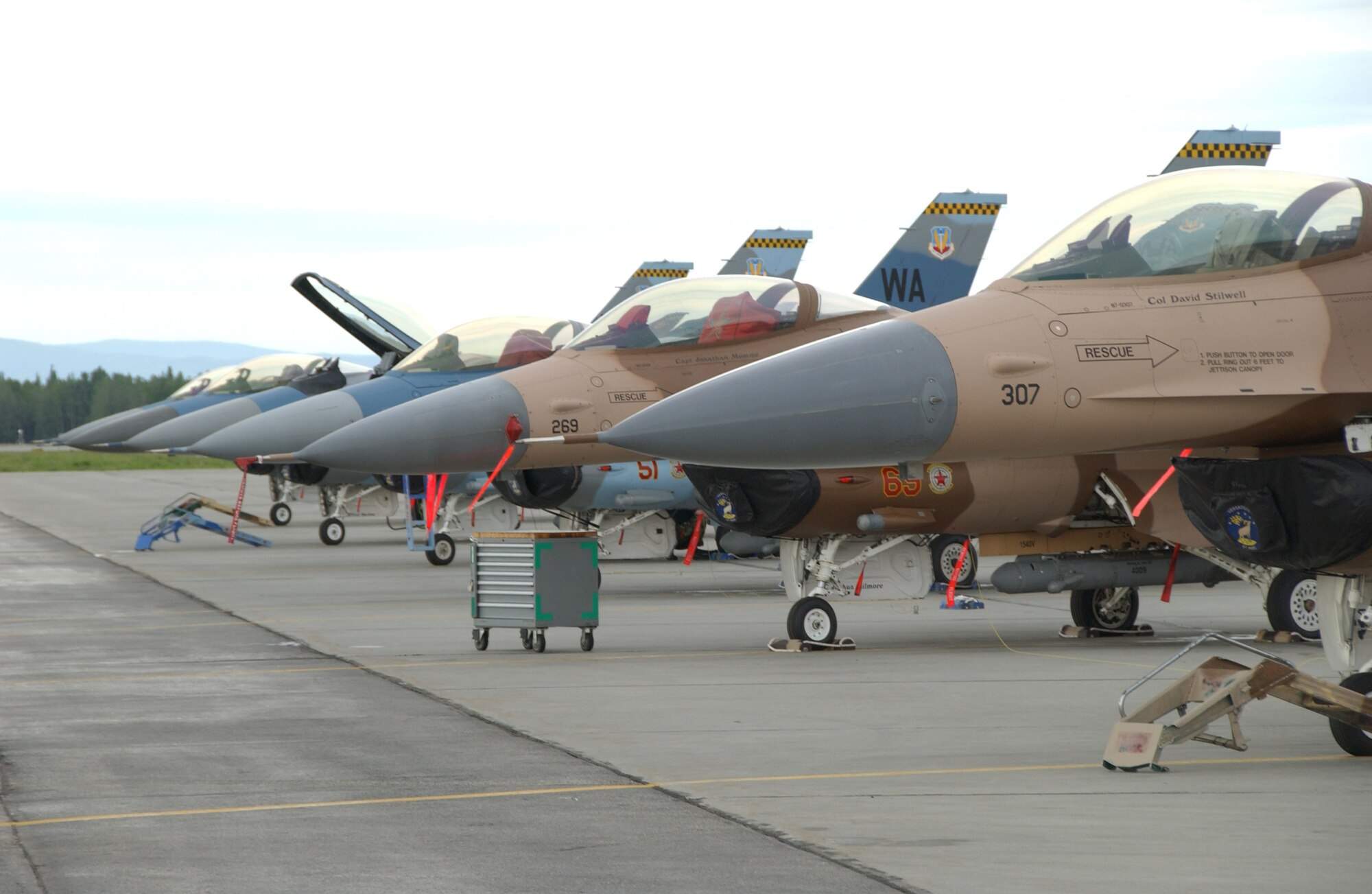 EIELSON AIR FORCE BASE, Alaska -- Six F-16's parked on the flightline prior to a mission for Red Flag-Alaska 07-02 June 5. There are 15 different units currently deployed at Eielson to participate in RF-A 07-02, including members from Singapore's Royal Air Force. (U.S. Air Force photo by Airman 1st Class Christopher Griffin)
