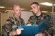 Tech. Sgt. James Black reviews a plan with 1st Lt. Steven Vick, executive officer, 13th Air Force Directorate of Installations and Mission Support.  USAF Photo by Capt. Yvonne Levardi.