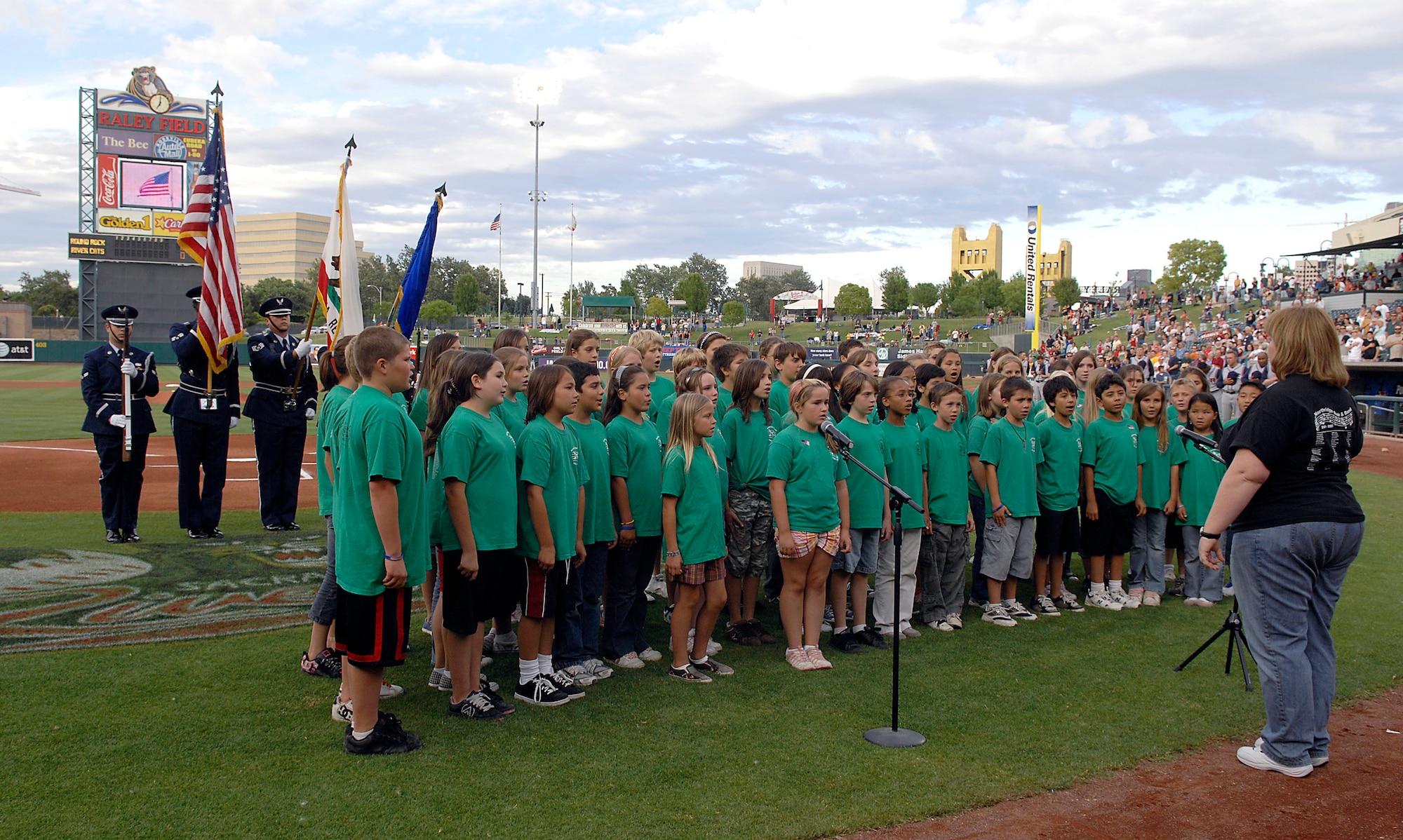 A fourth, fifth and sixth grade choir from Northridge Elementary School sings the national anthem before a local minor league baseball game June 4 during Air Force Week in California. The purpose of Air Force Week is to inform and educate the American public about the importance and roles of the Air Force in America's national defense. (U.S. Air Force photo/Tech. Sgt. Larry A. Simmons)
